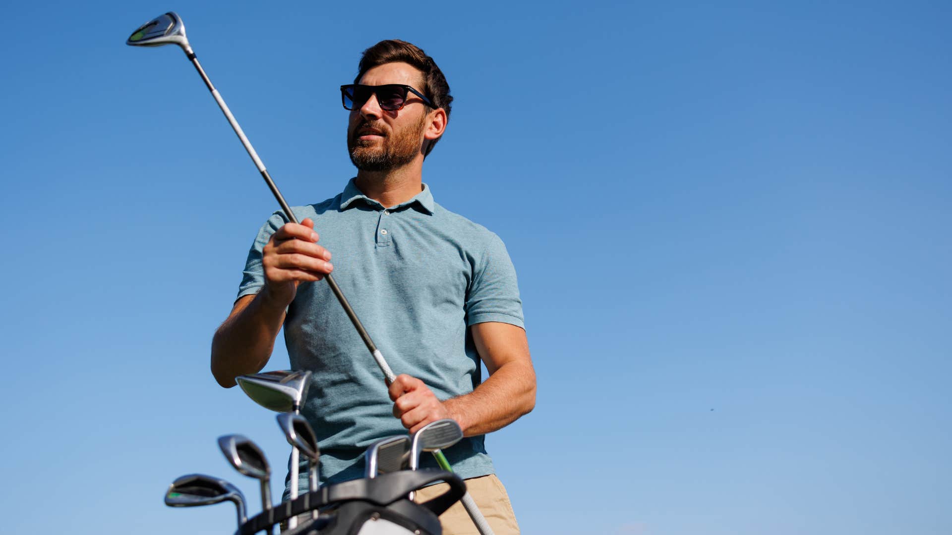 a man goes golfing at a country club