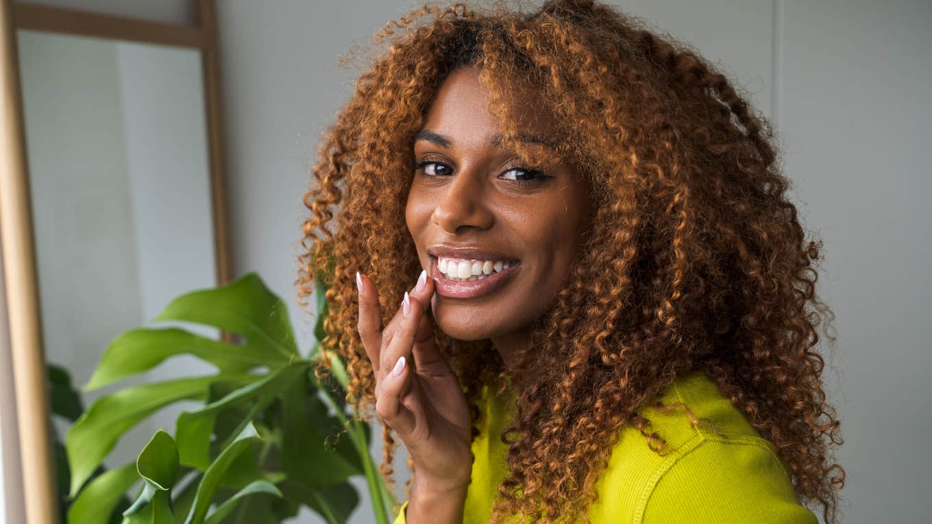 classy woman thinking hard and smiling