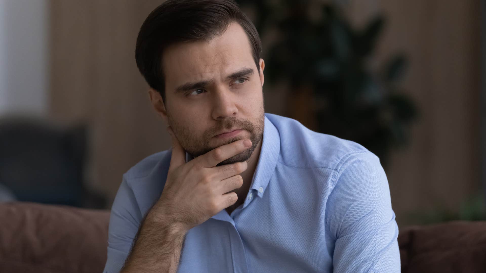 emotionally exhausted upset man struggling with making decisions
