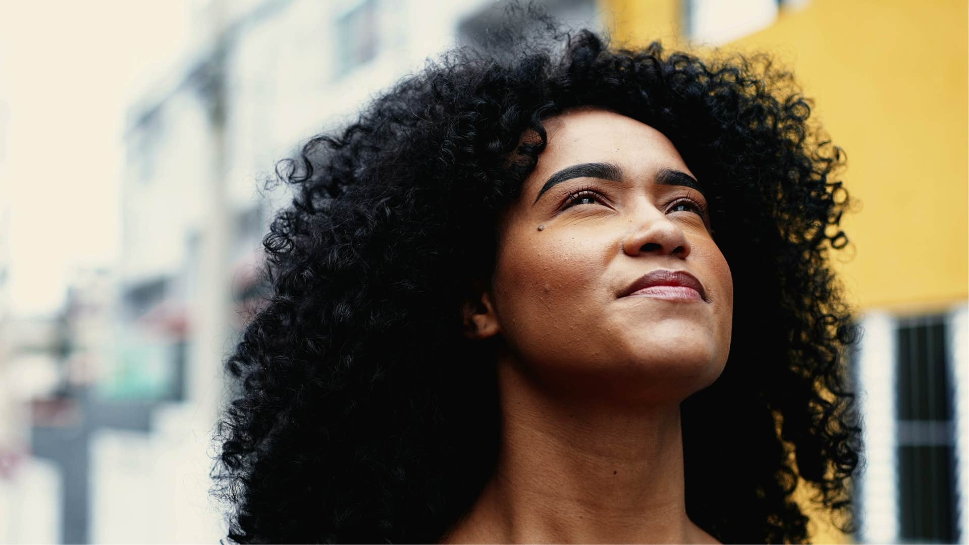 Happy woman feels powerful