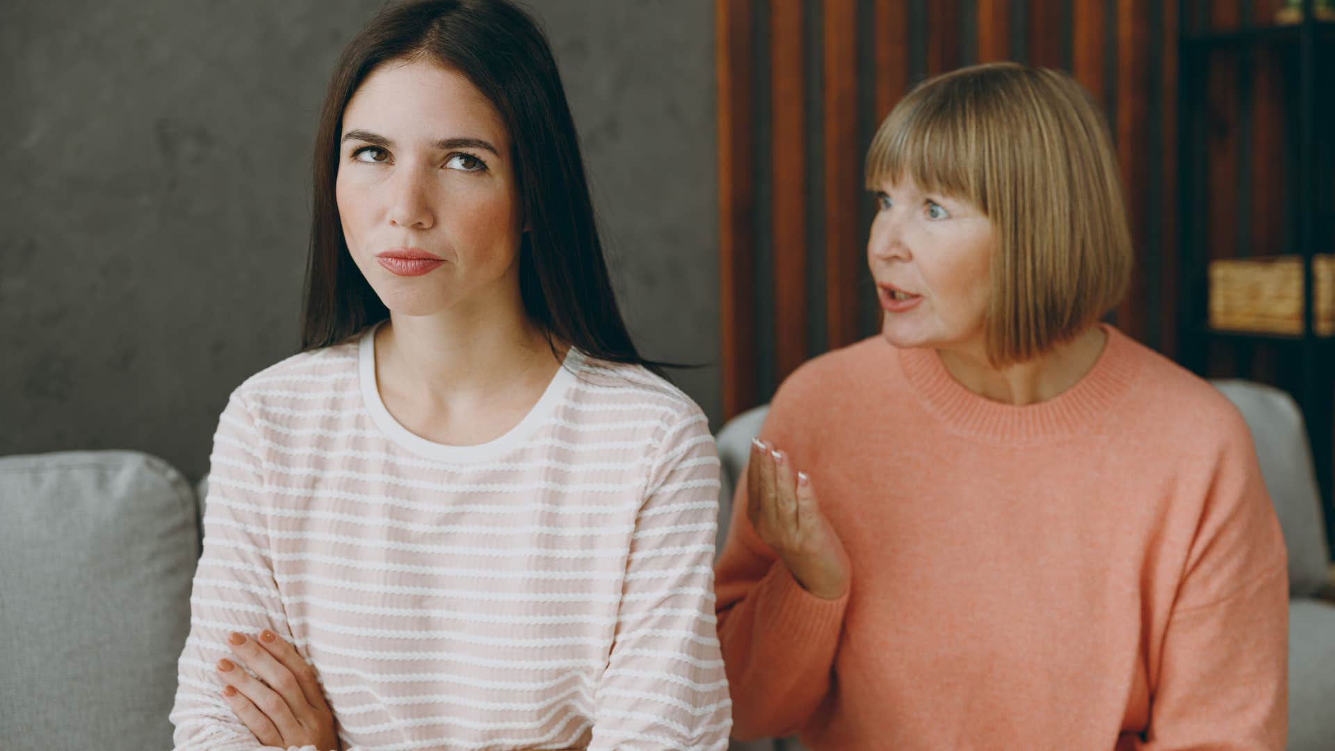 Adult woman making excuses for financial irresponsibility to her mother.