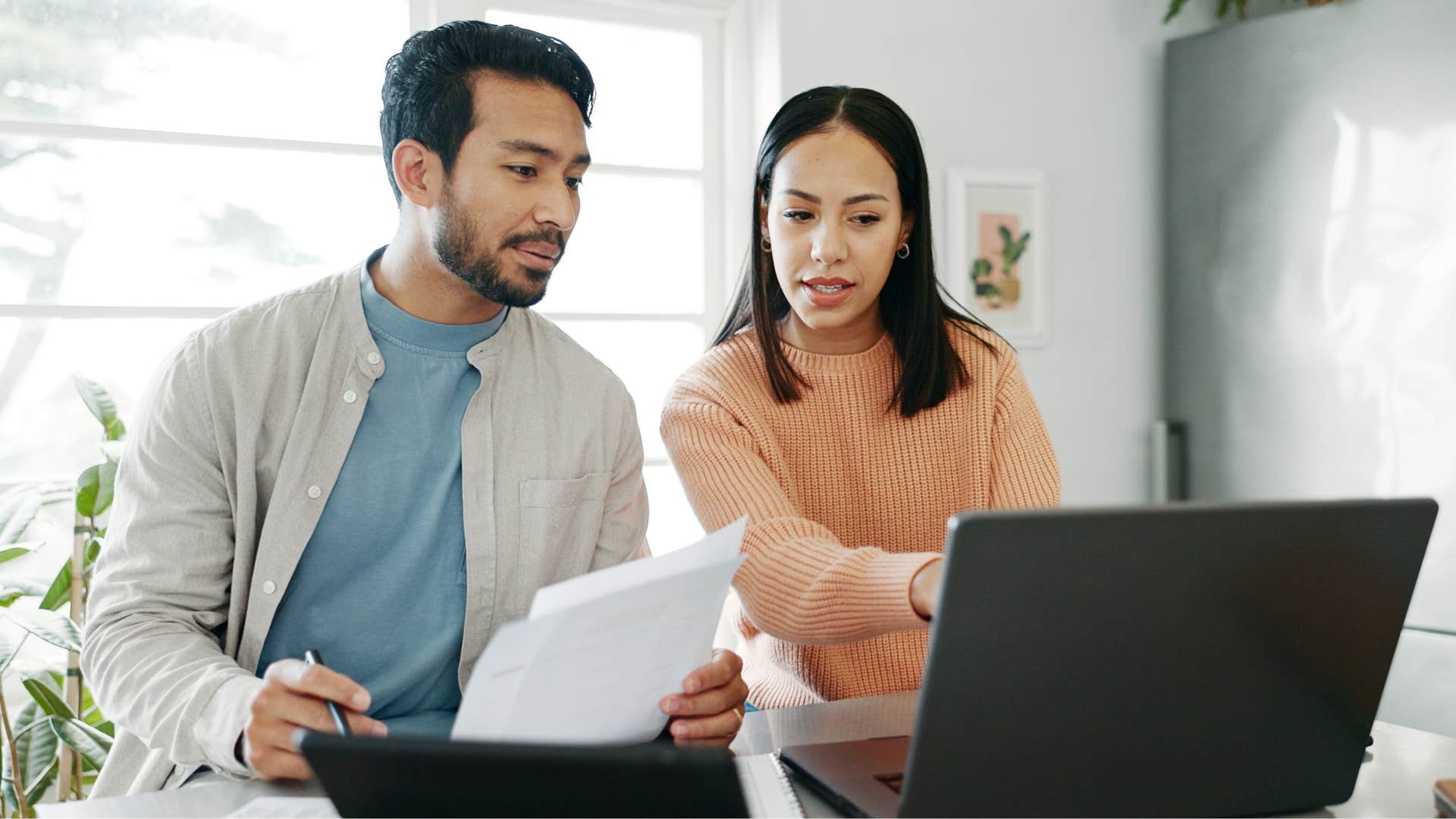 Woman spending too much on rent and doing bills.