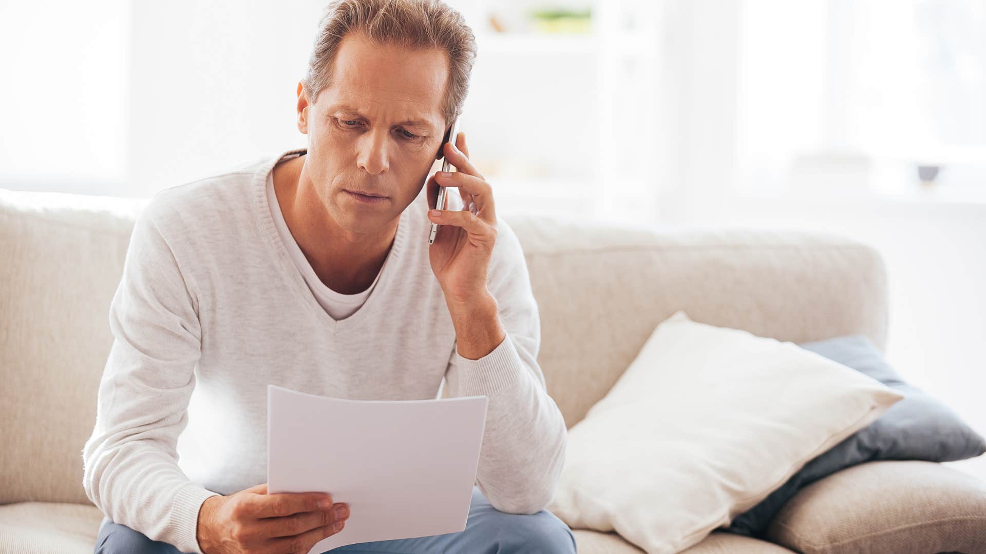 frugal man on the phone negotiating his bills
