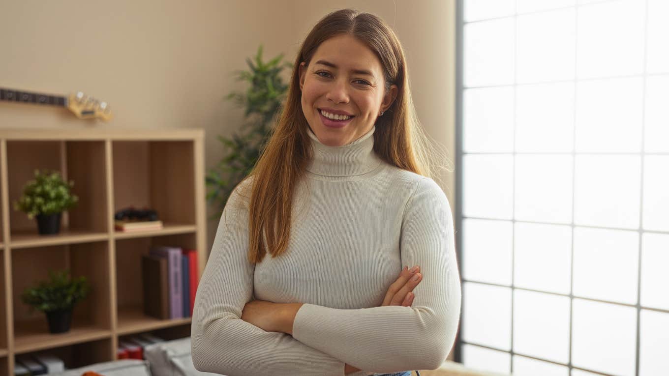 Things Frugal People Will Fix Themselves Before Ever Paying Someone Else frugal woman smiling after saving money