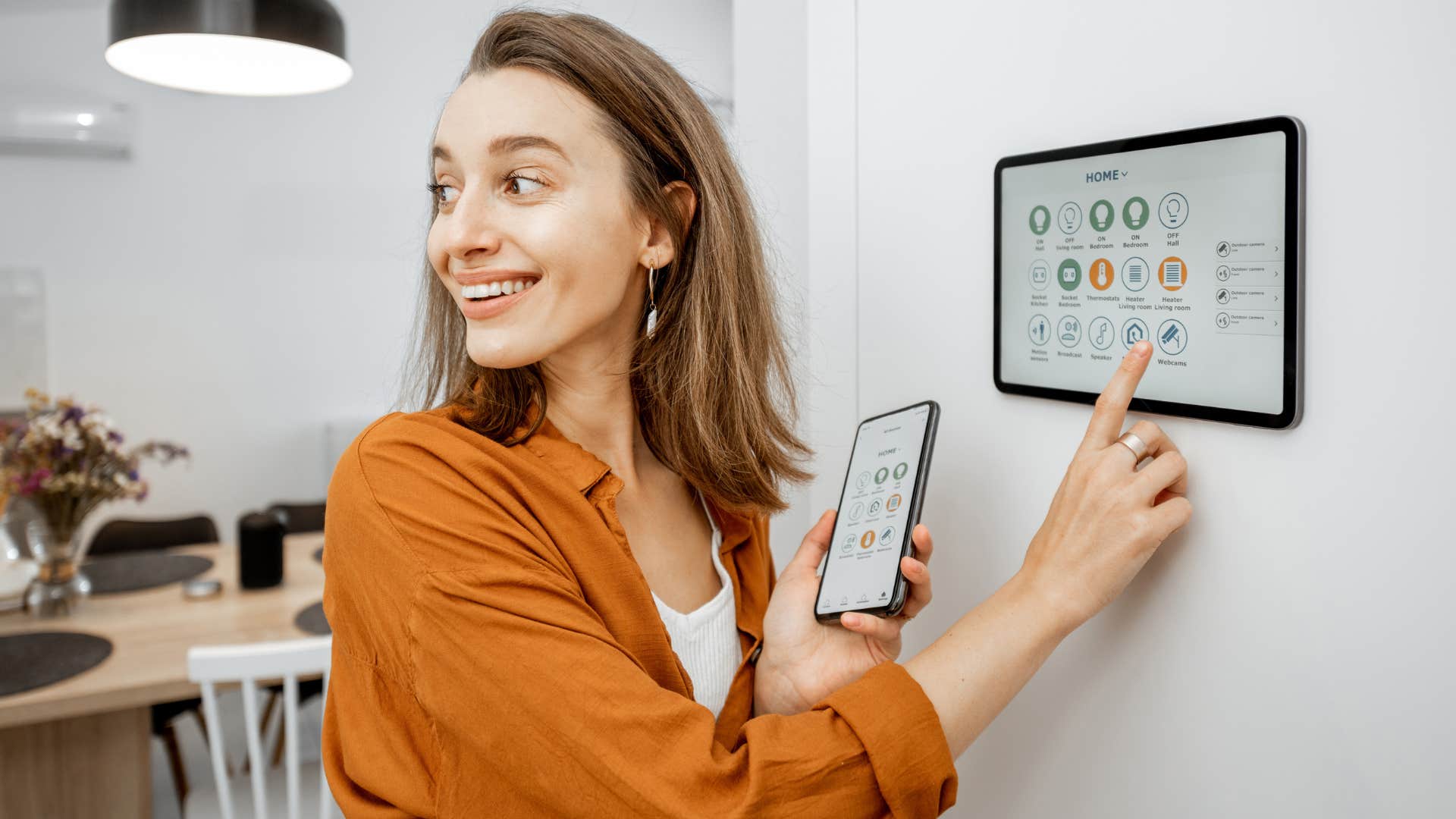 rich woman with smart devices in every corner of home