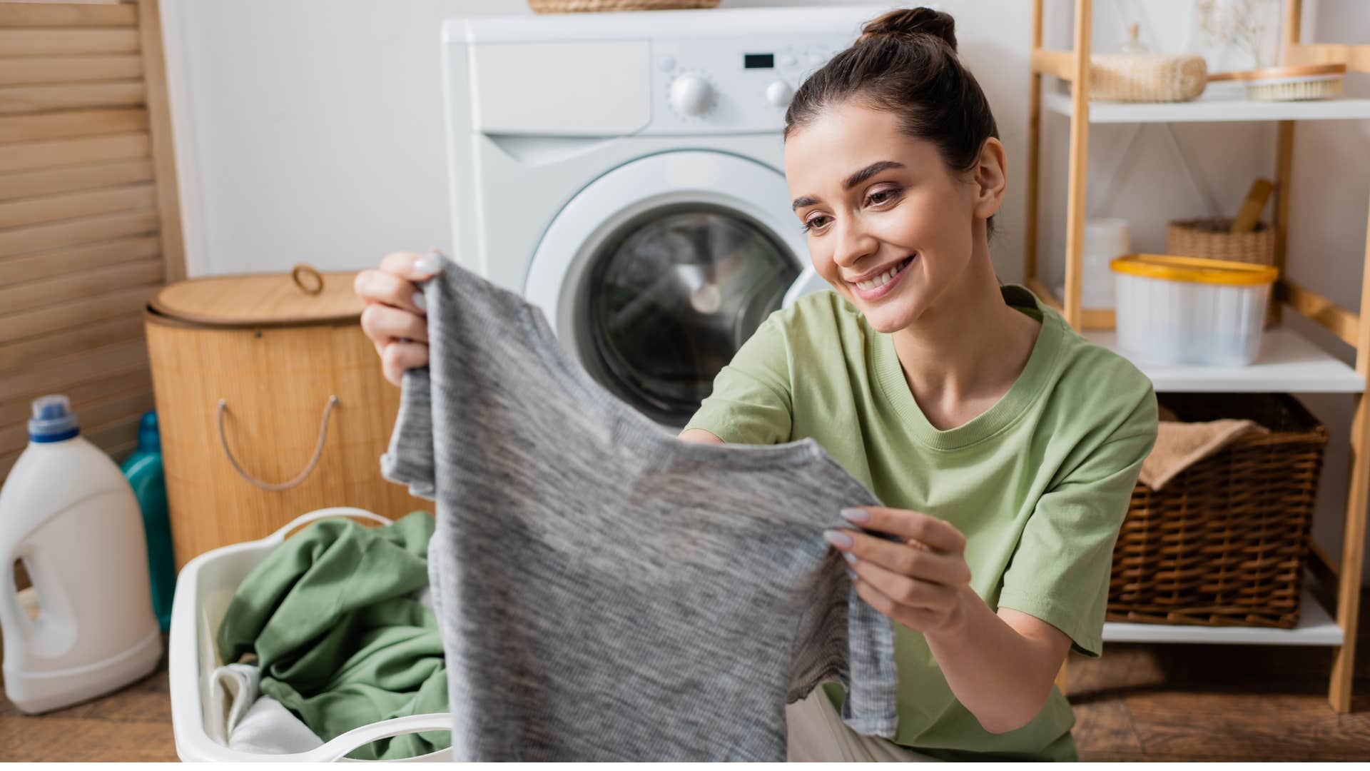 woman folding old t-shirts to save