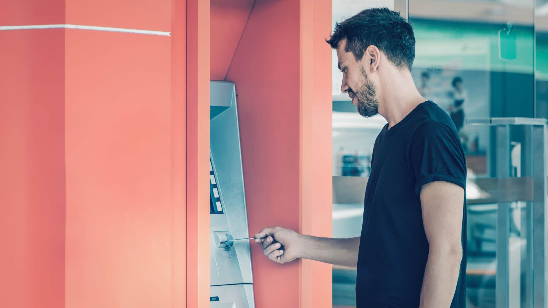 man regretting using an atm after paying a fee