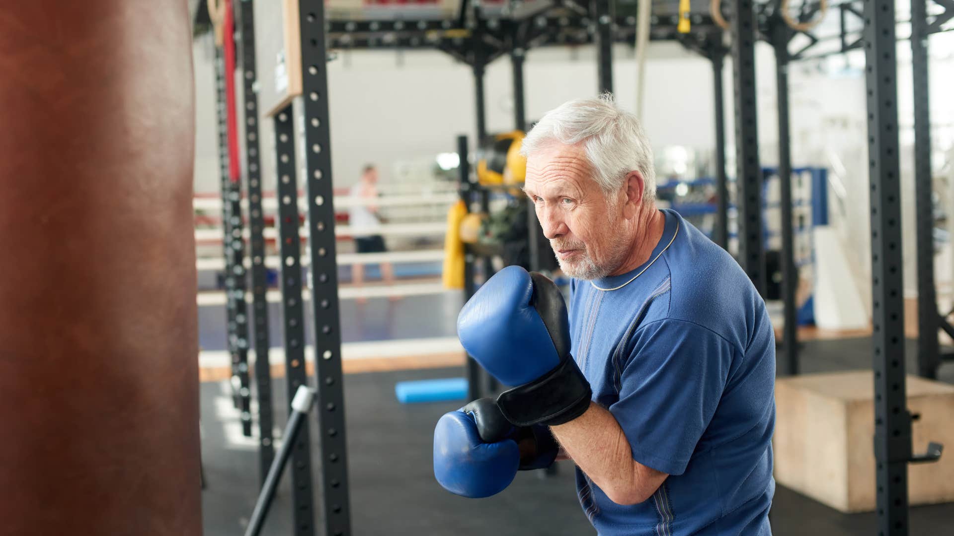 older man boxing at the gym