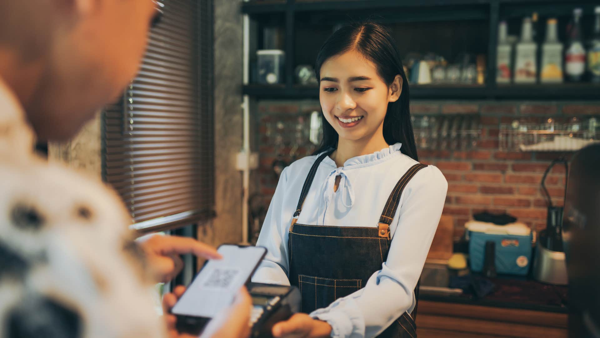 man ordering his daily coffee at a cafe