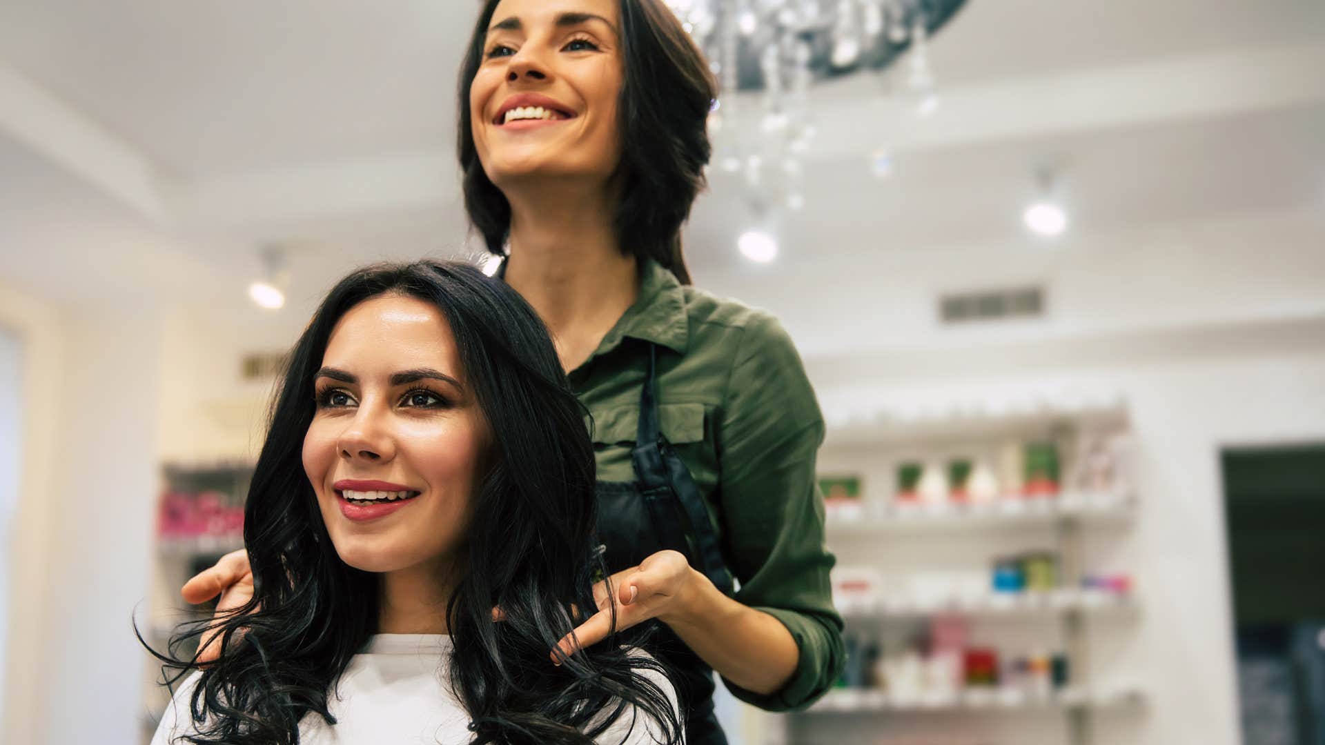 woman getting her hair cut at a salon
