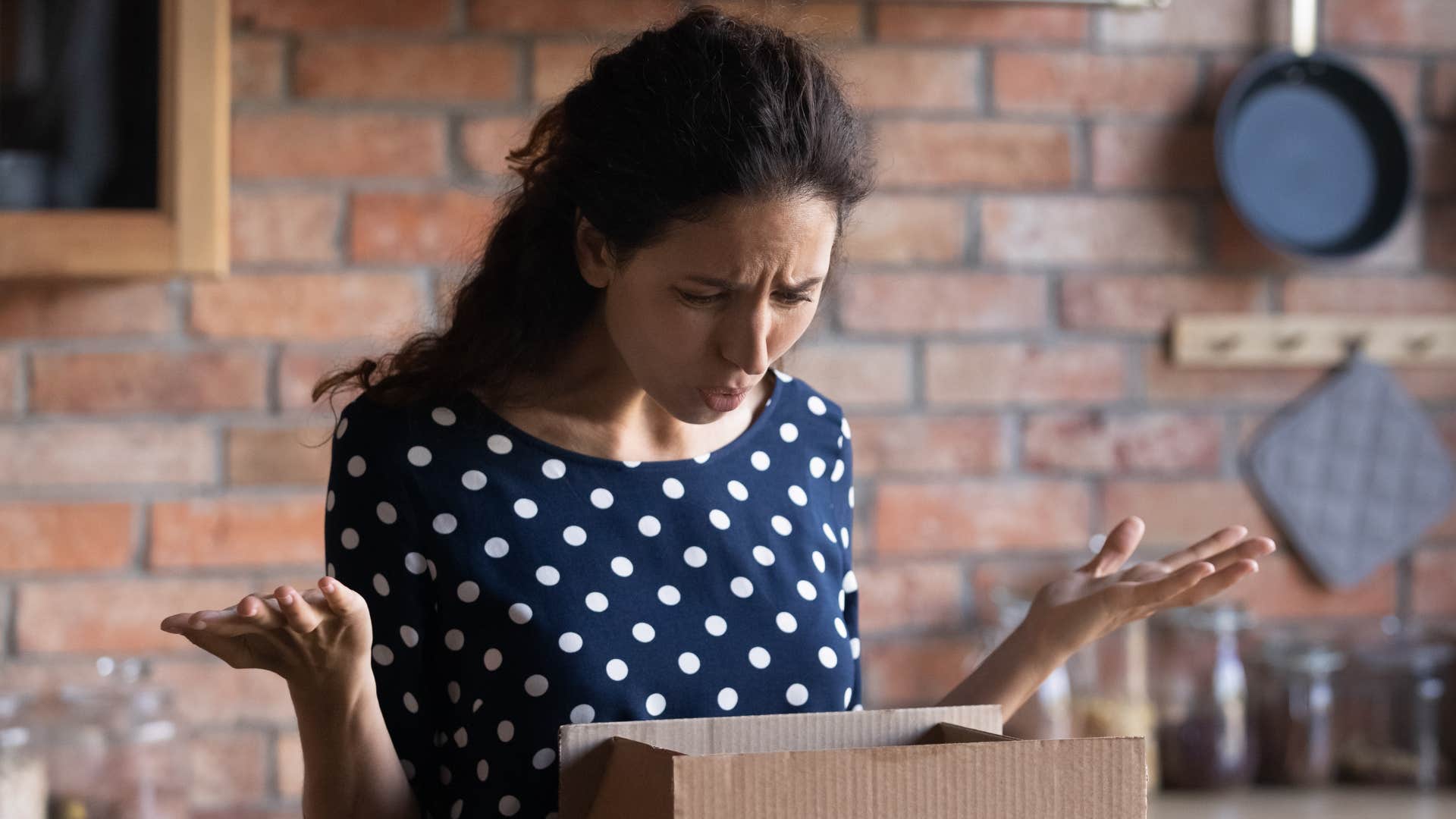 woman realizing she made an impulsive purchase