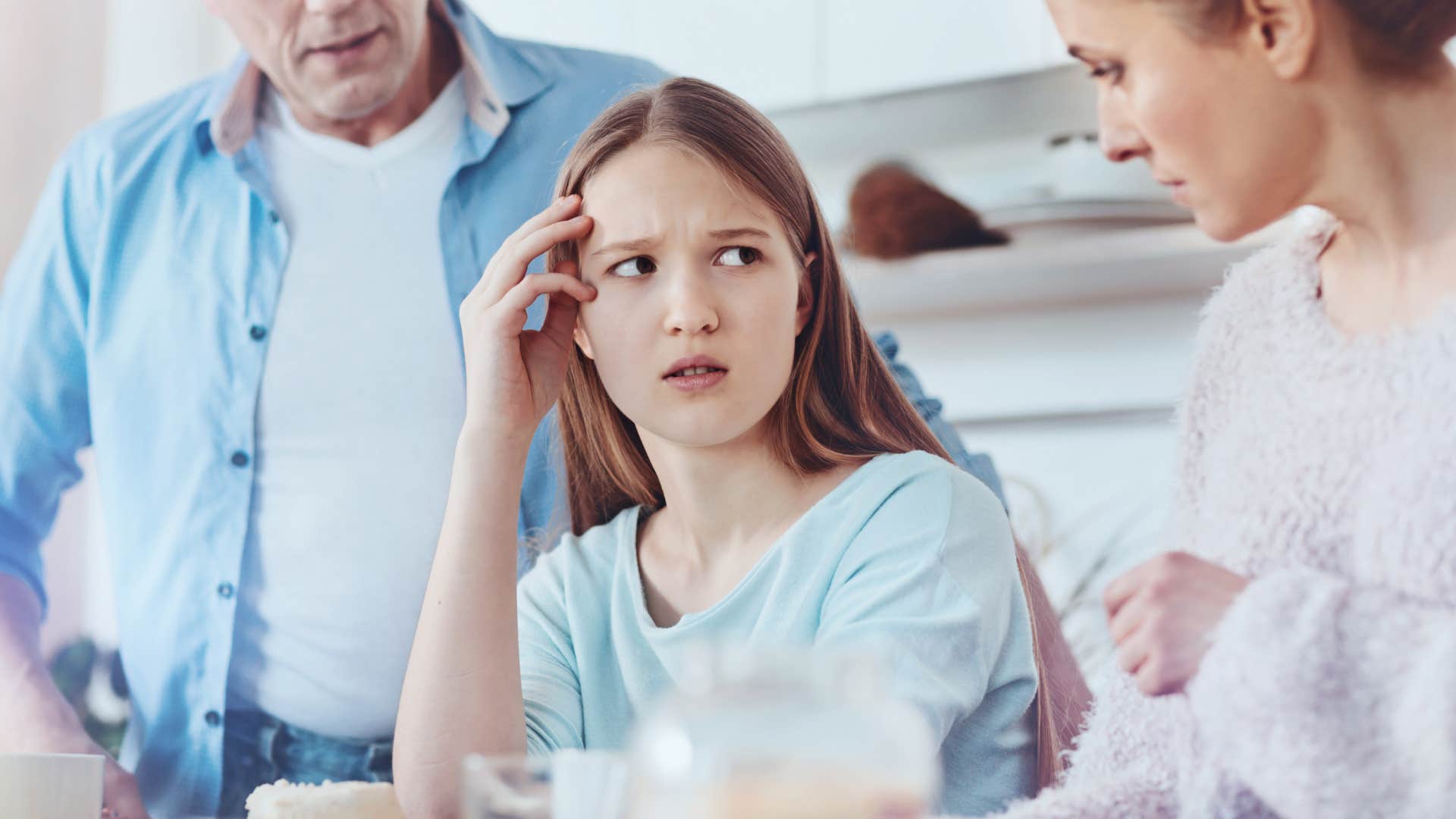 woman making complaints about another parent to her teenage daughter
