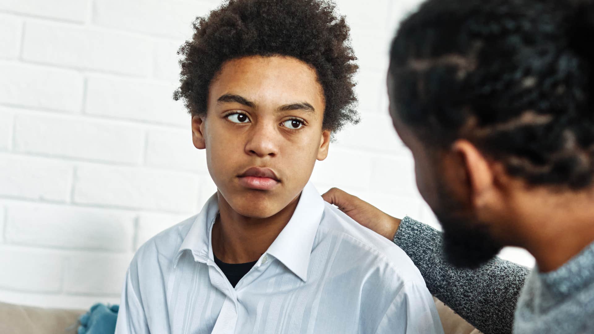 man using negative self-talk in front of his teenage son