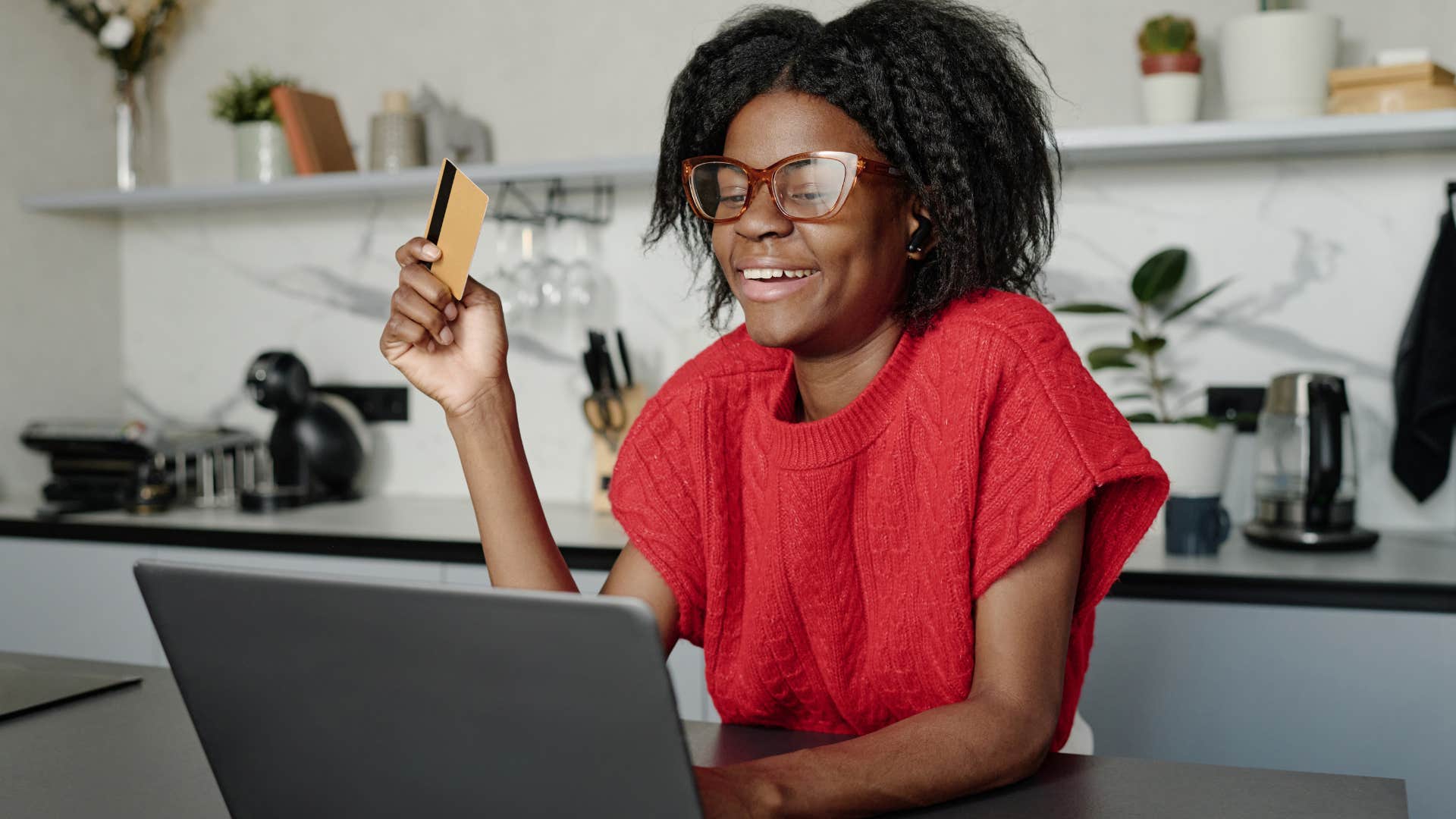 Woman indulging consumerist culture on her laptop.