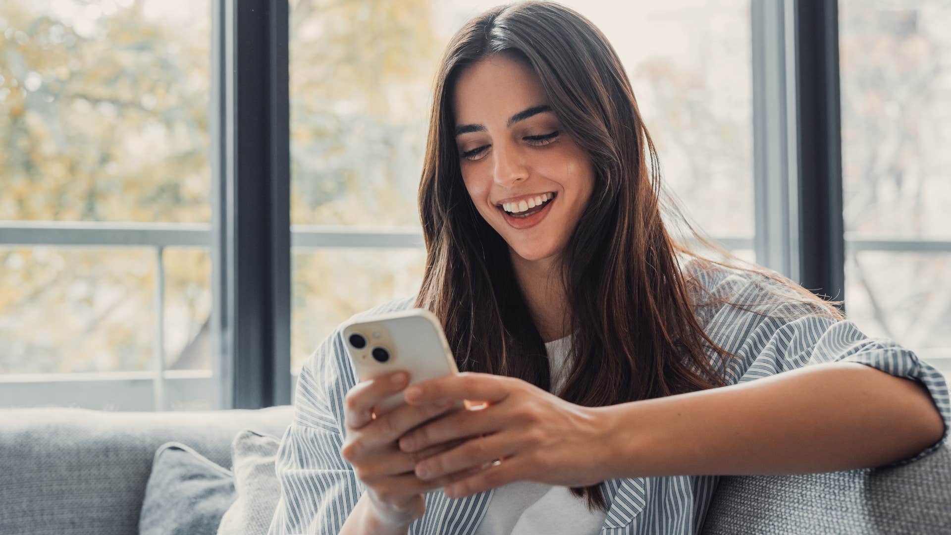 Woman following mainstream trends on her phone.