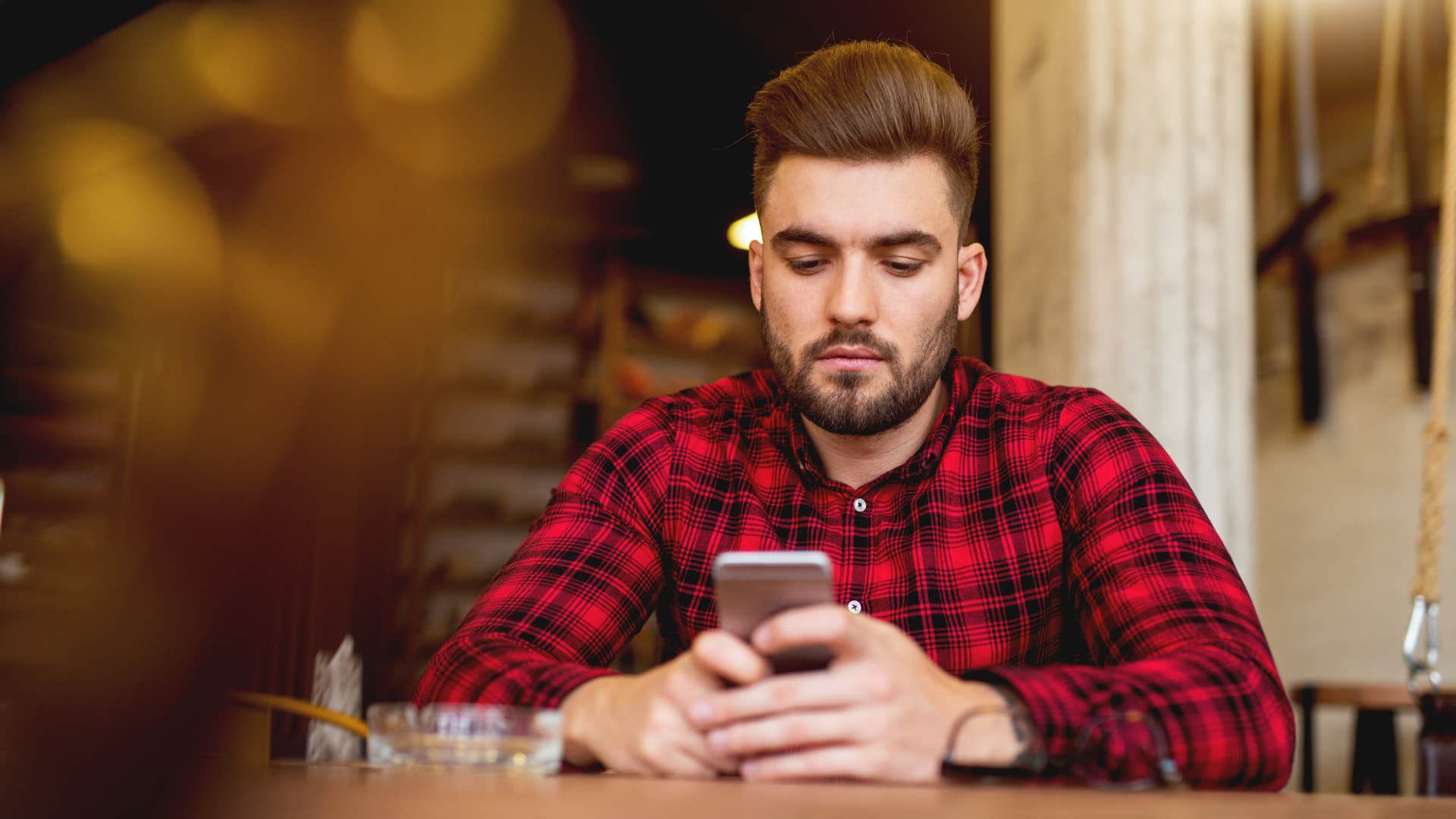 Man using too much social media on his phone.