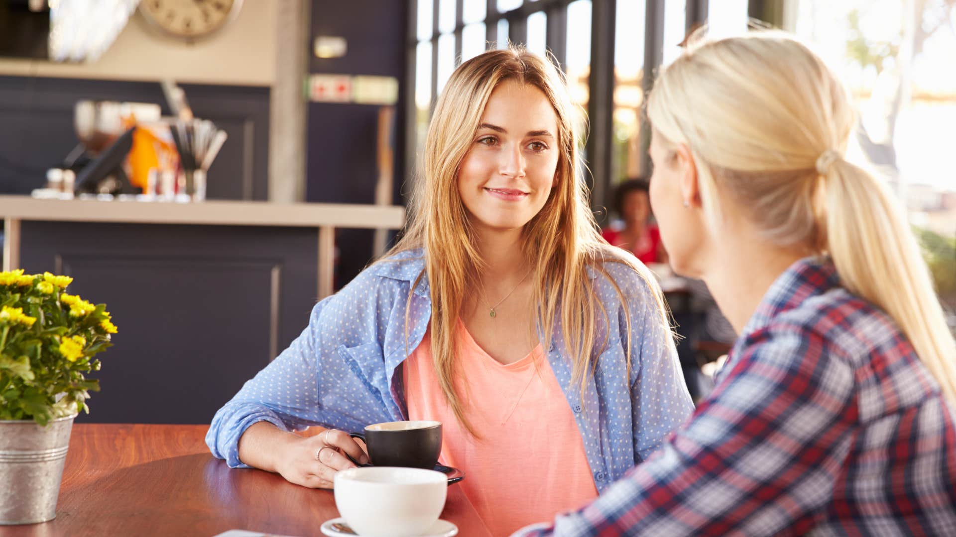 two women talking in coffee shop