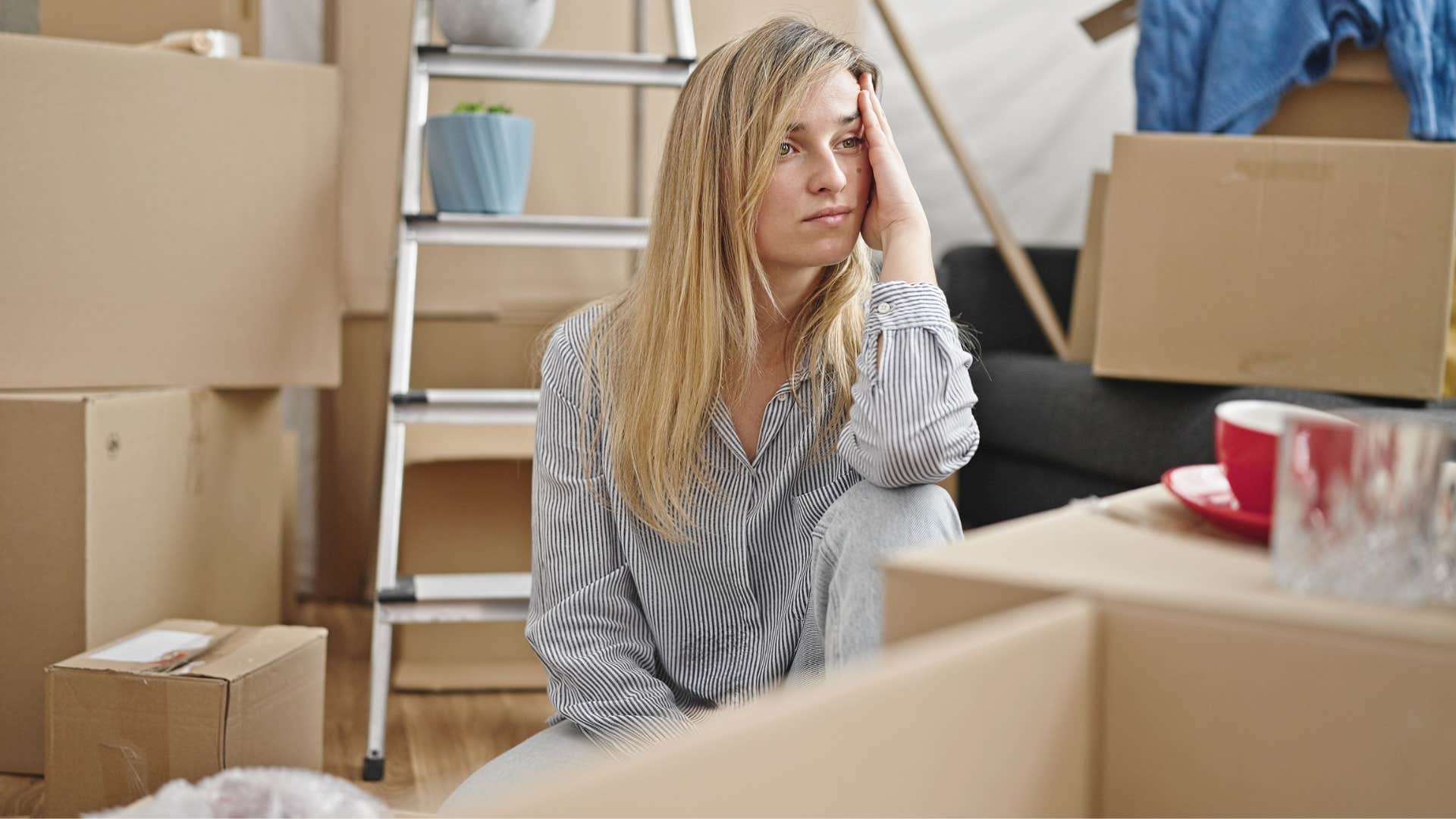 a woman still has her furniture boxed up despite moving in months ago