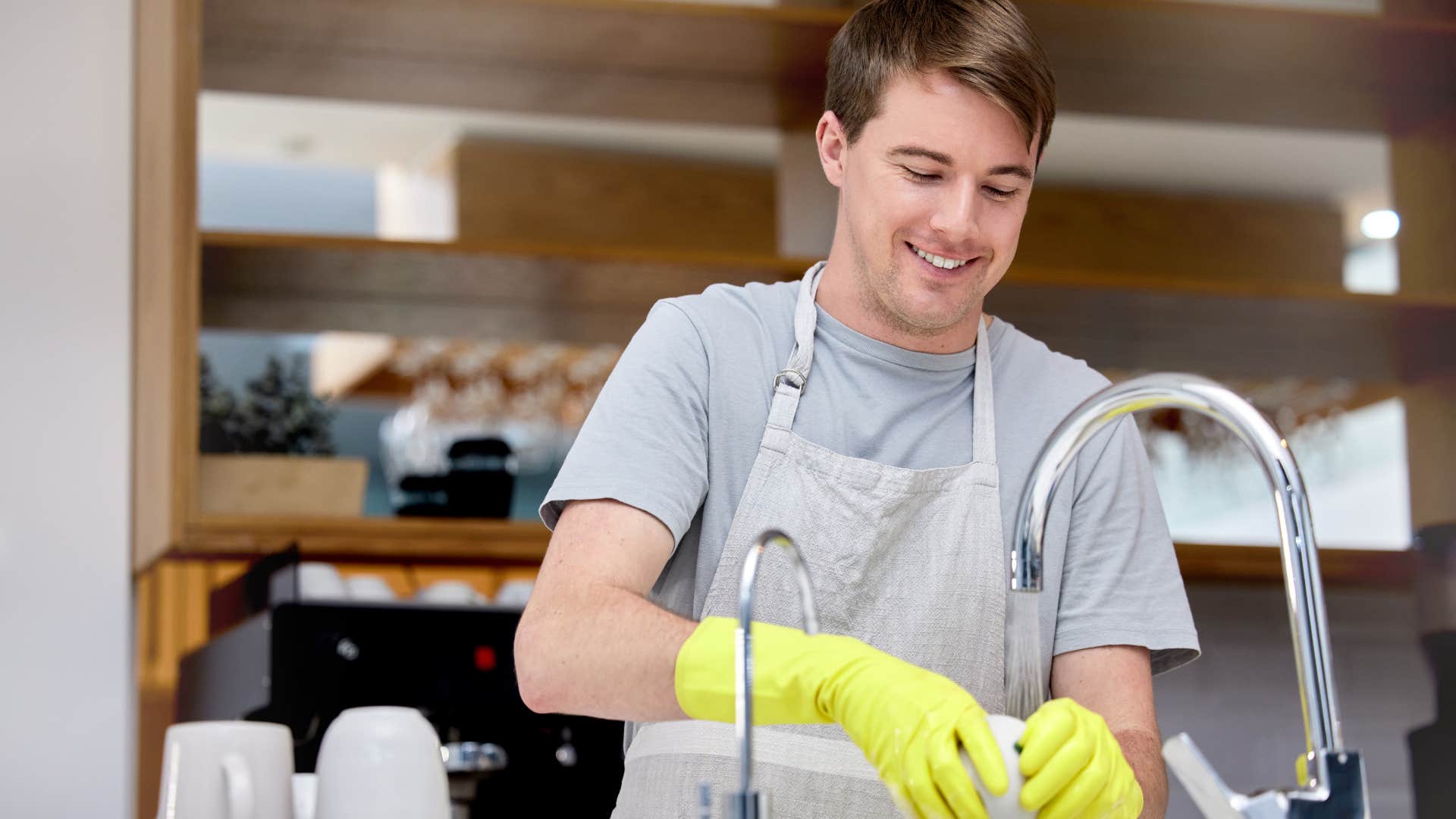 man using dish soap as the only cleaning product in his kitchen