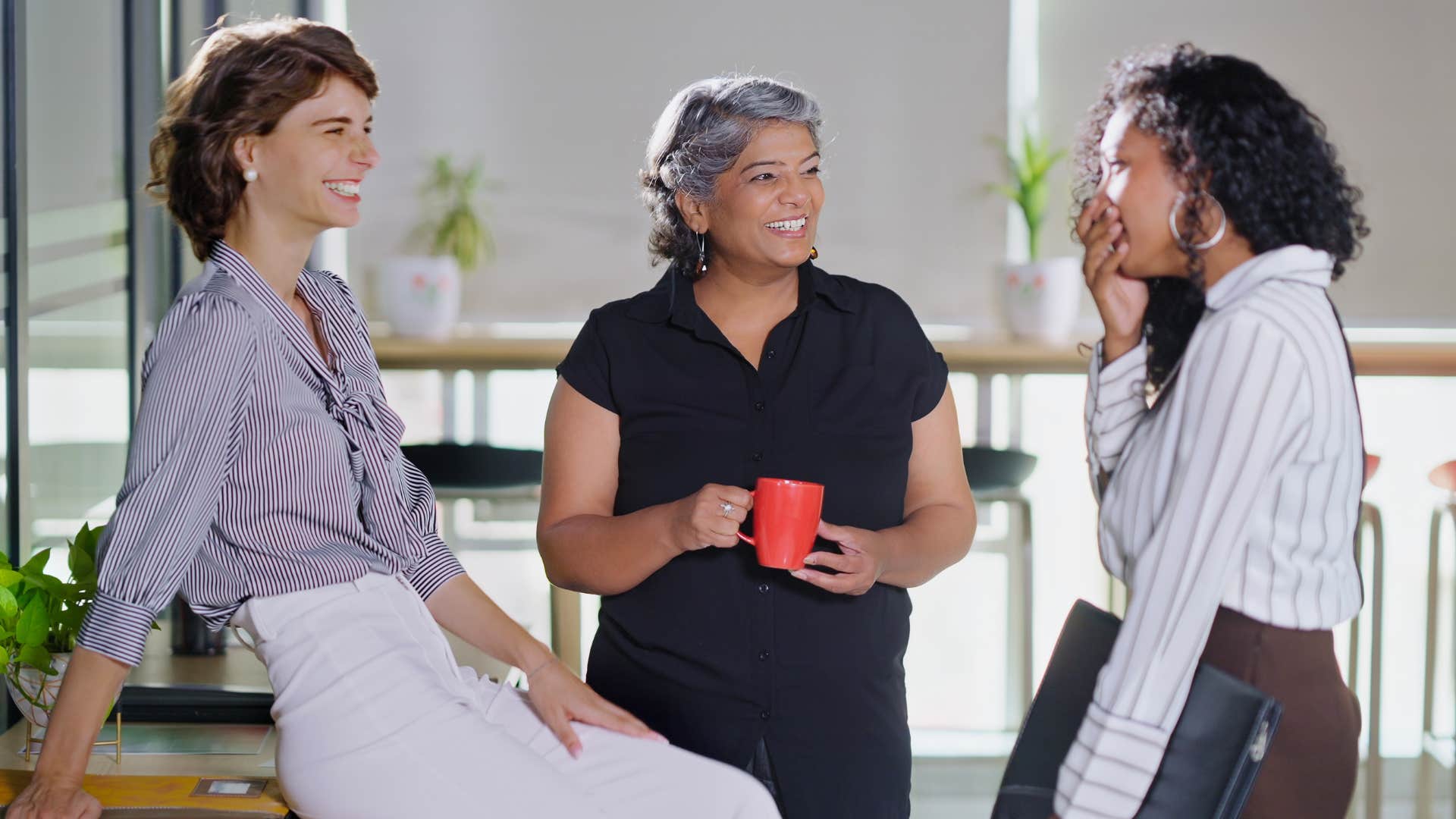 group of friends making fun of co-workers