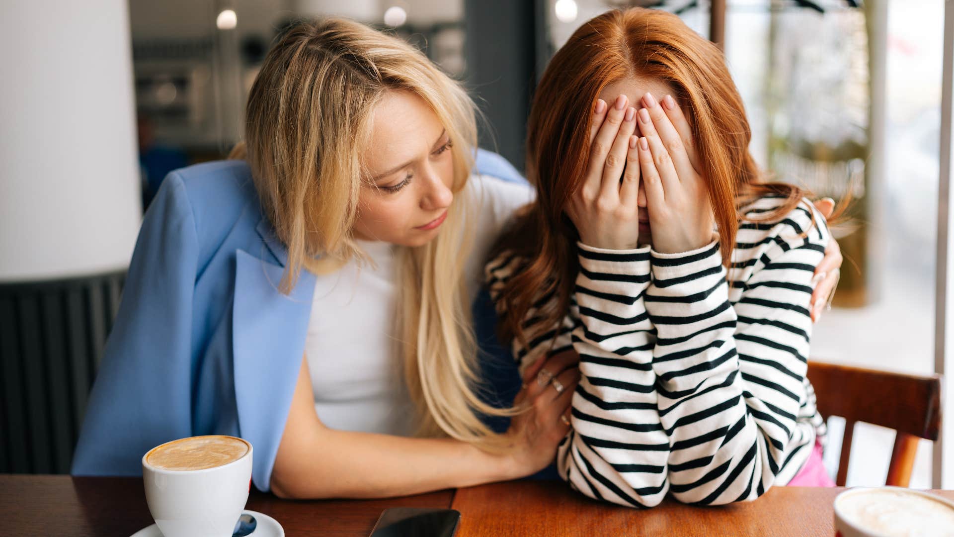 woman comforting friend playing the victim