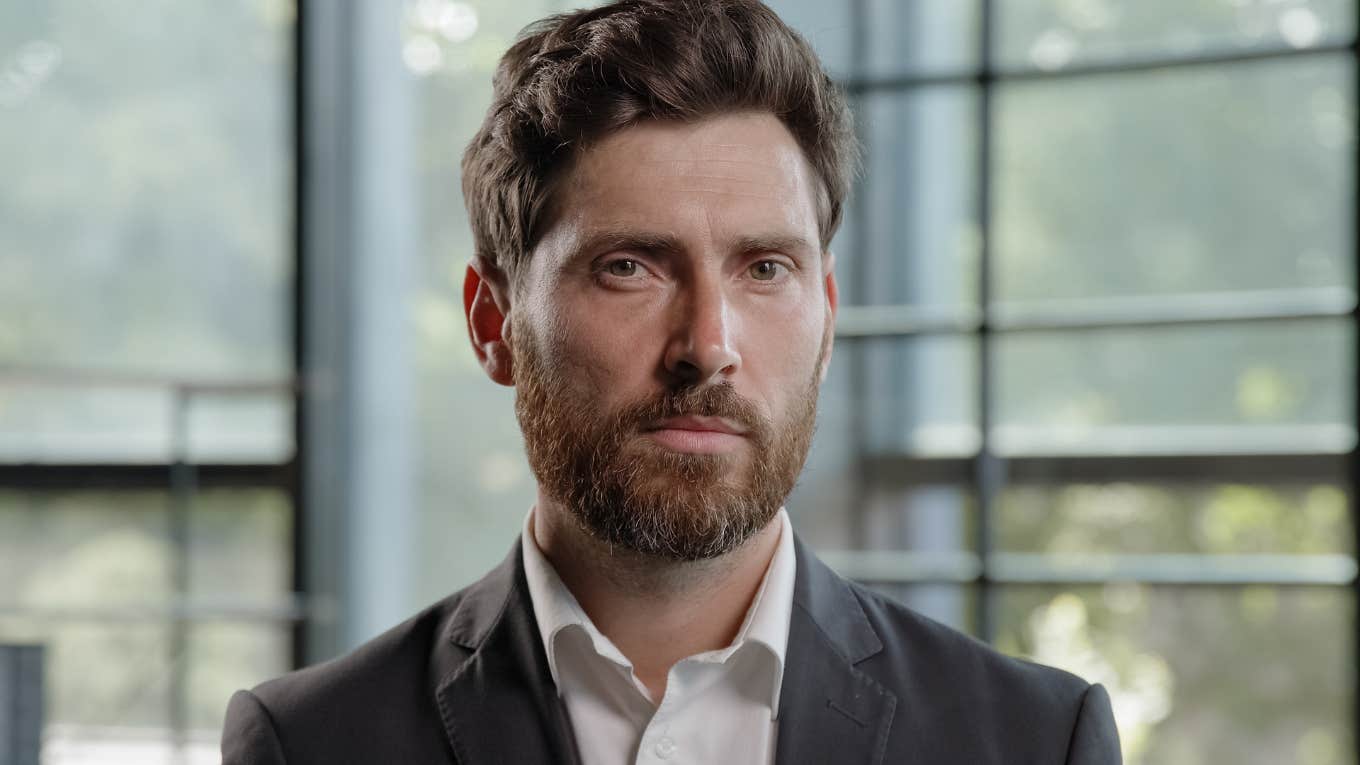 upset serious boss noticing low value employees in workplace