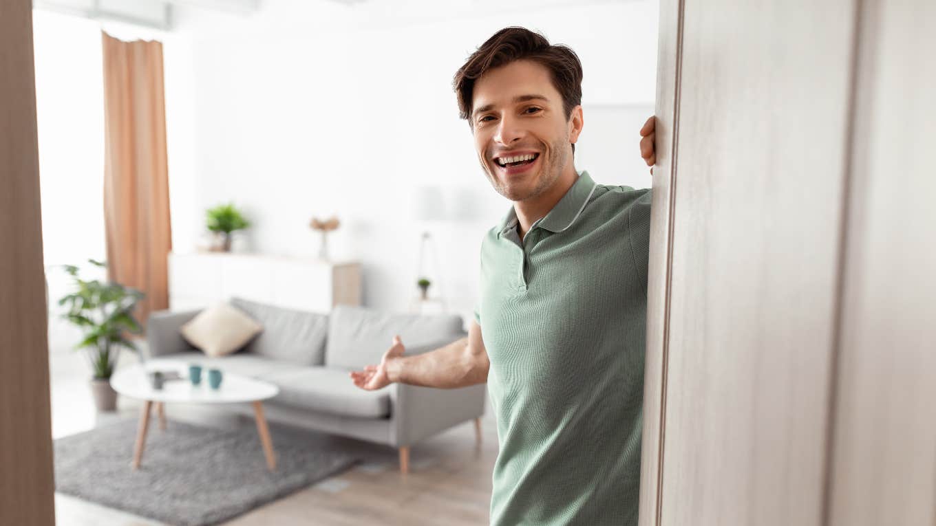 loyal man opening the door to his home to woman