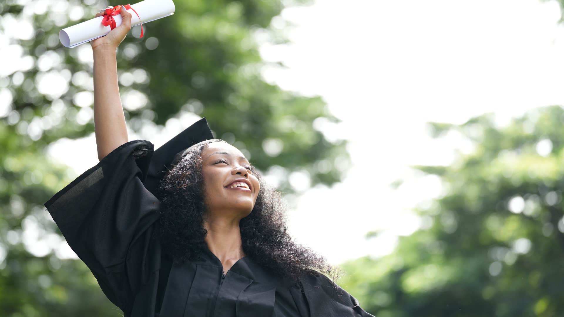 woman with degree after graduating