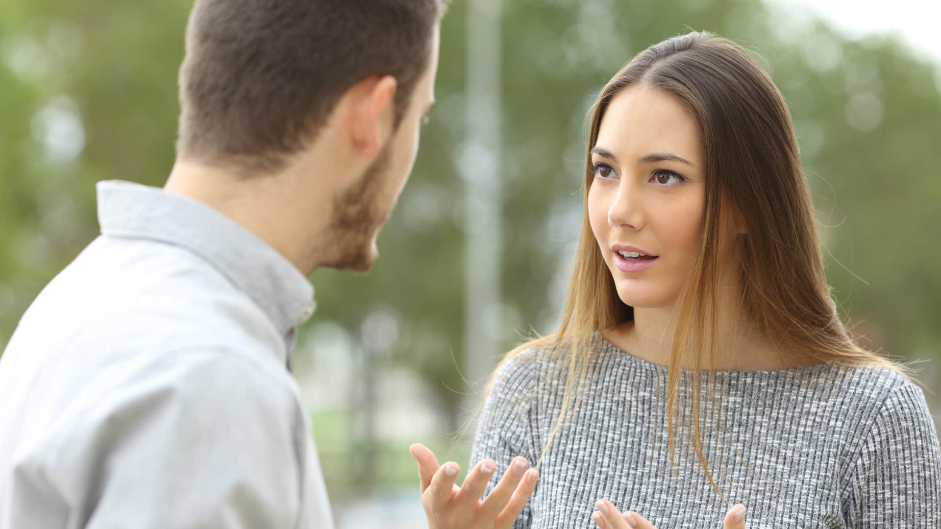 upset woman asking boyfriend to fight her battles for her