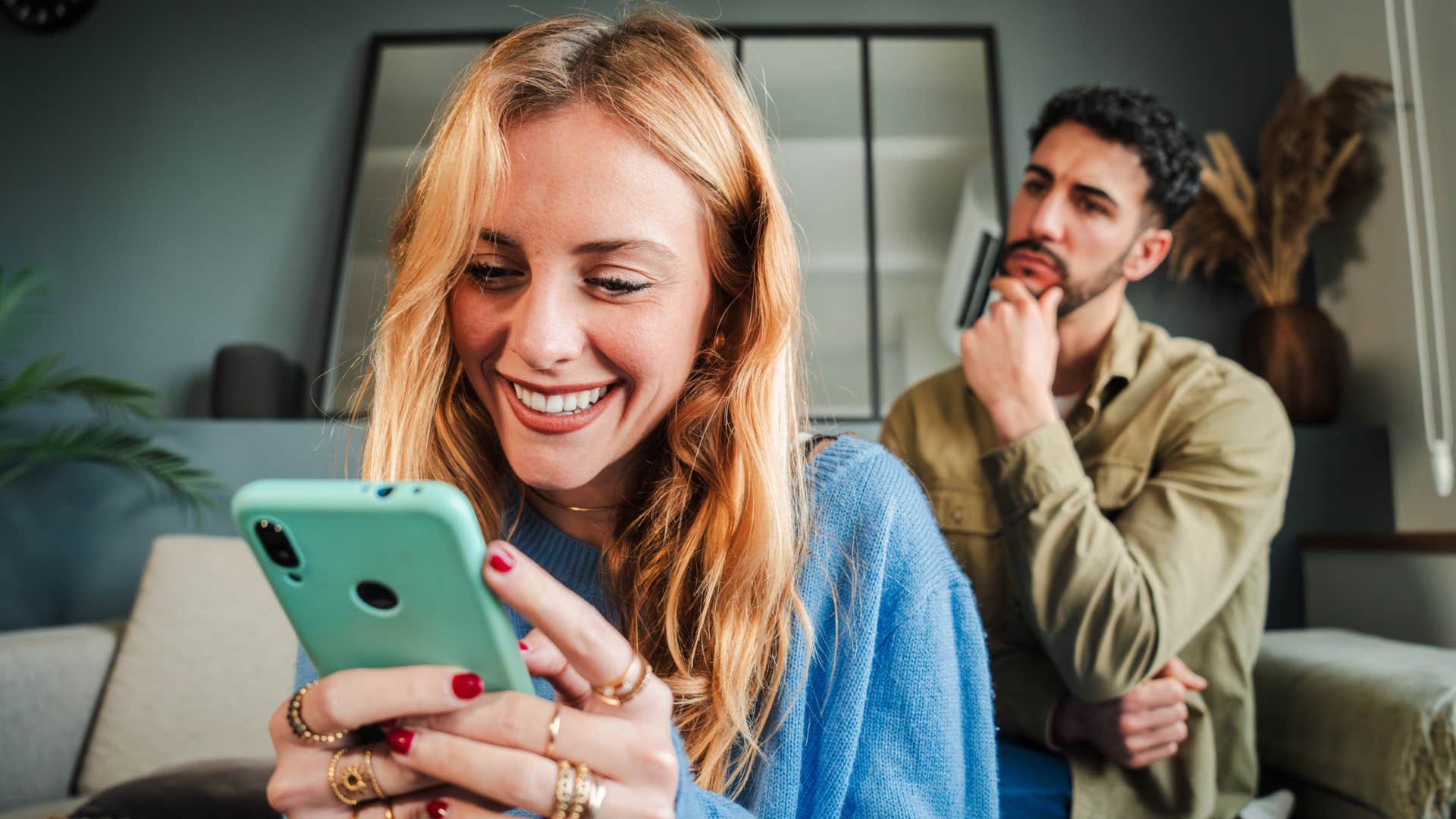 man annoyed that girlfriend keeps posting about their relationship on social media