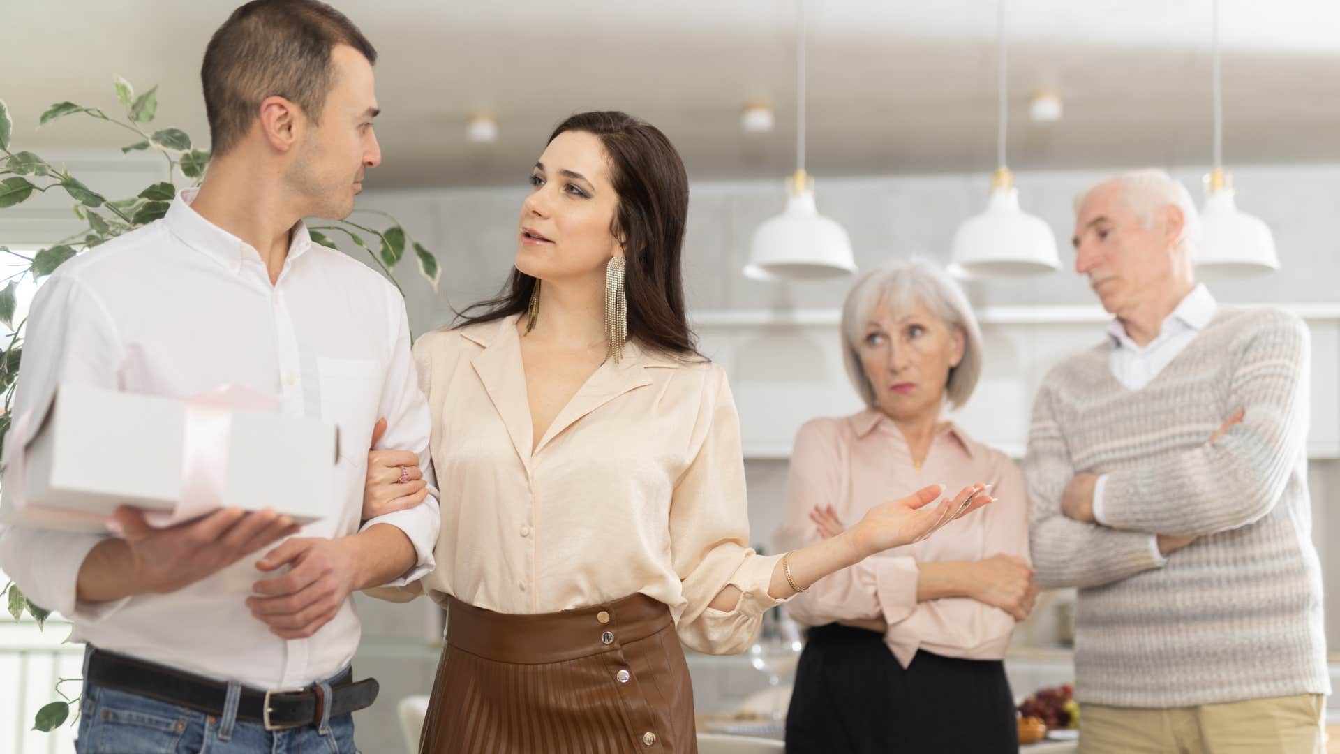 woman trying to get partner to talk badly about his family in front of them