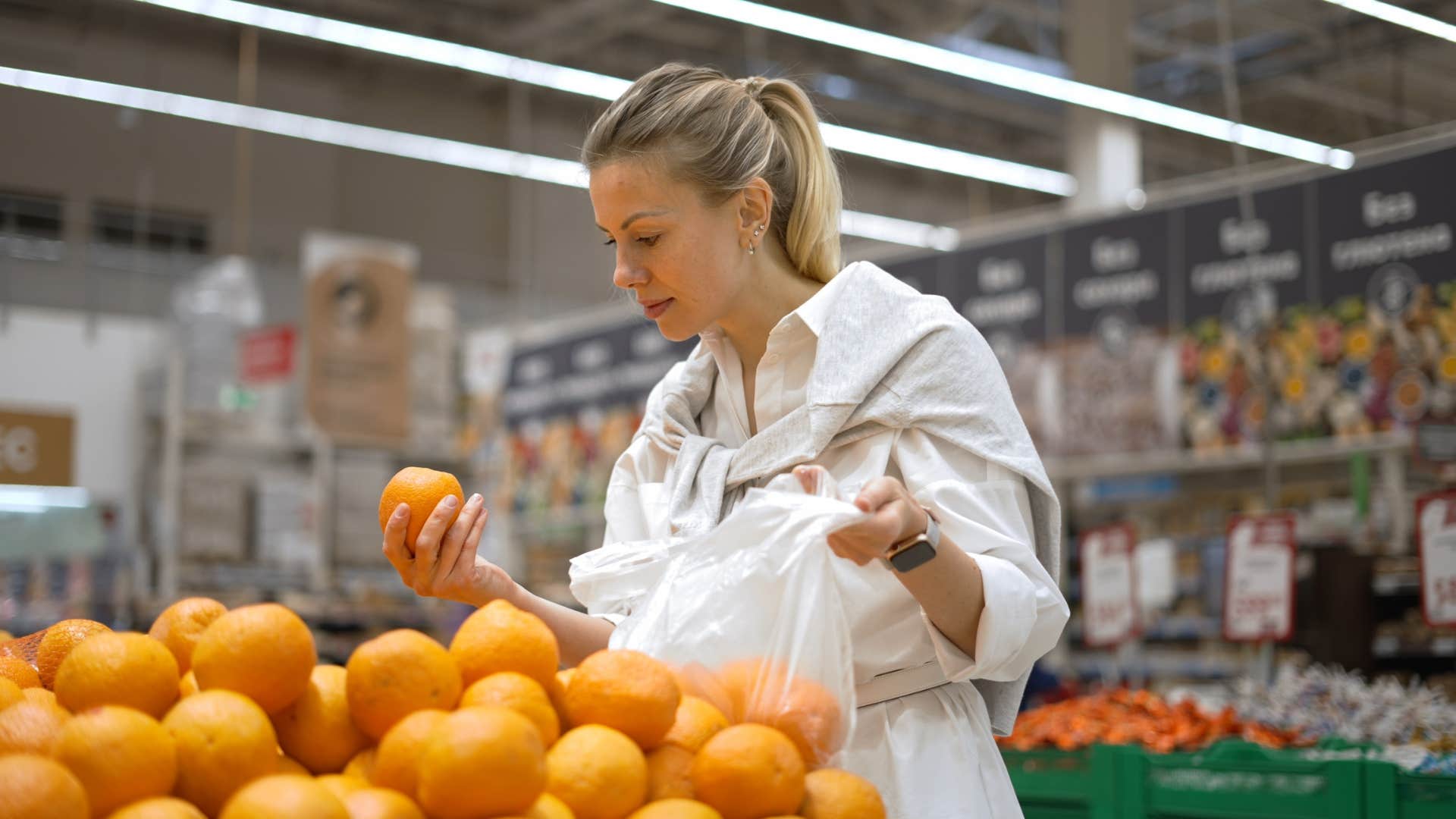 woman reusing bags at the grocery store