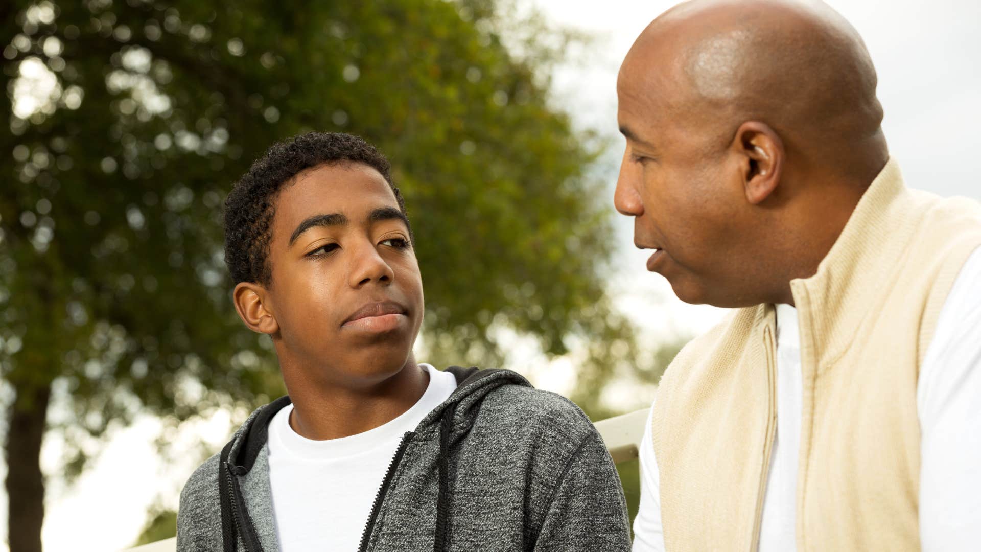 Man talking about conformity with his son.