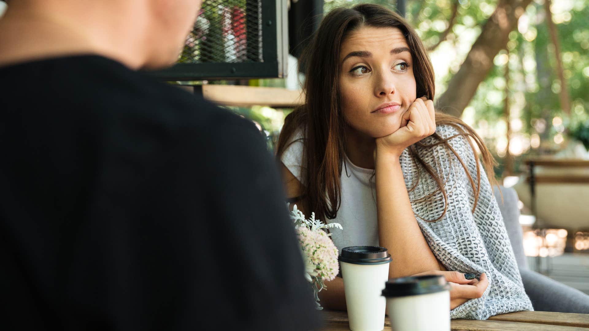 Woman annoyed with ignorance sitting with a man.