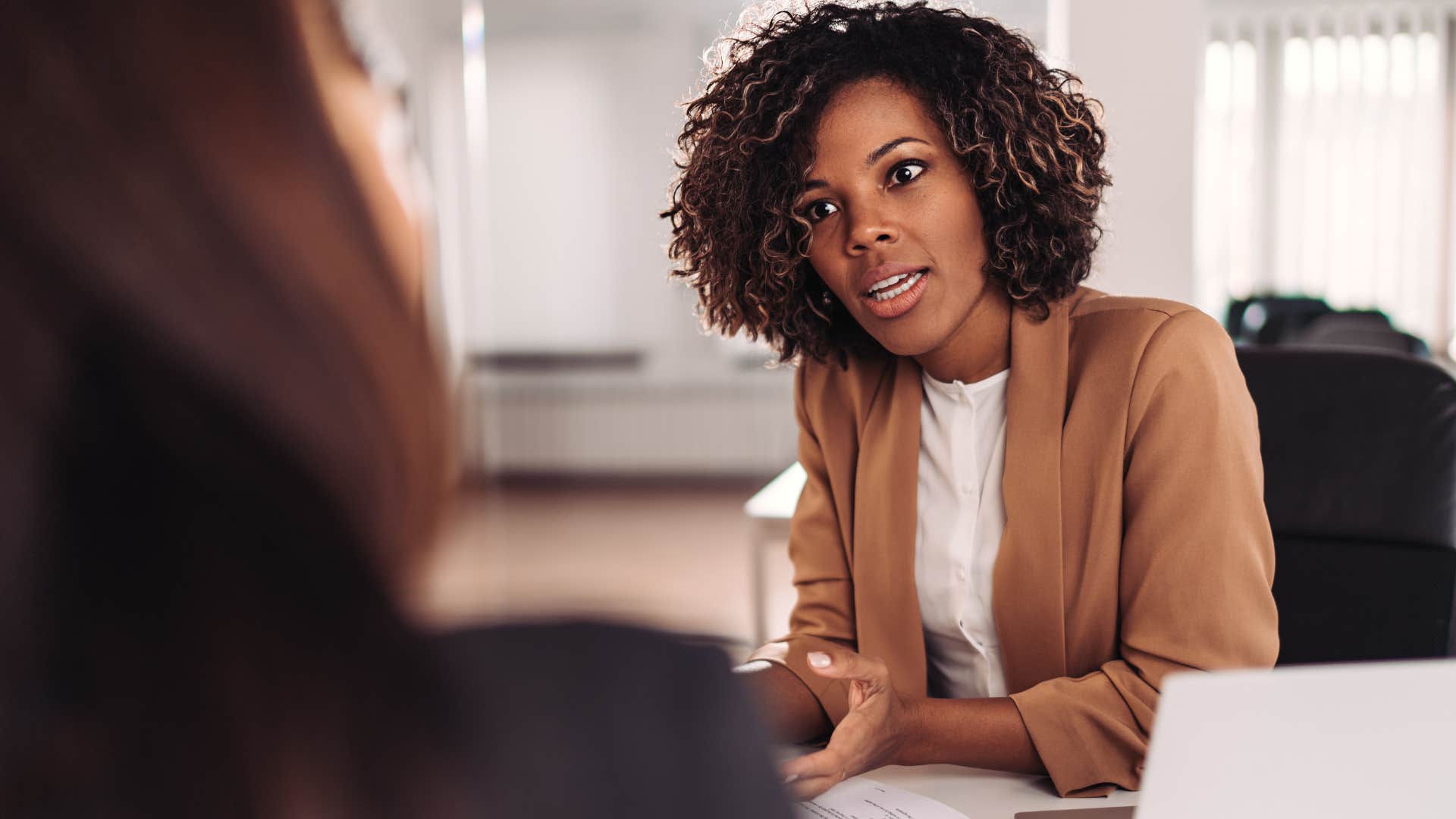 Woman proving their intelligence in a work meeting.