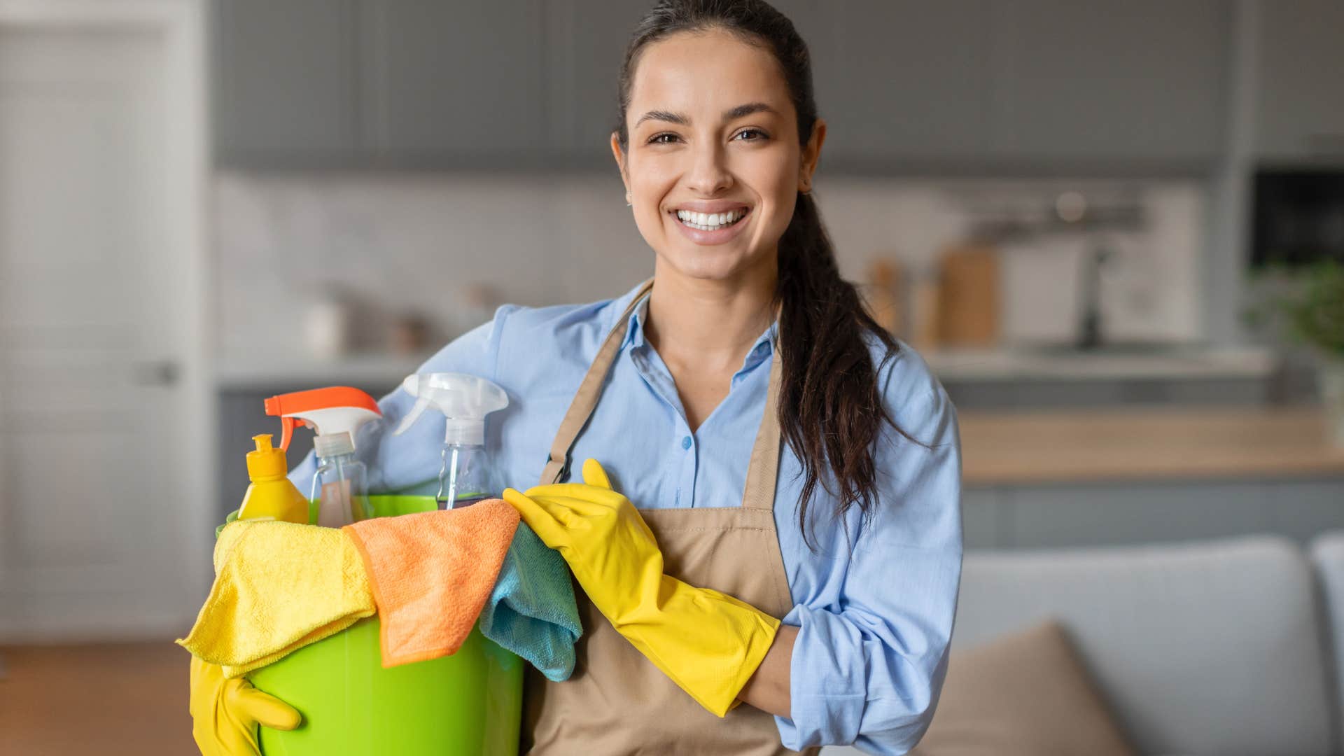 Housekeeper smiling at the camera.