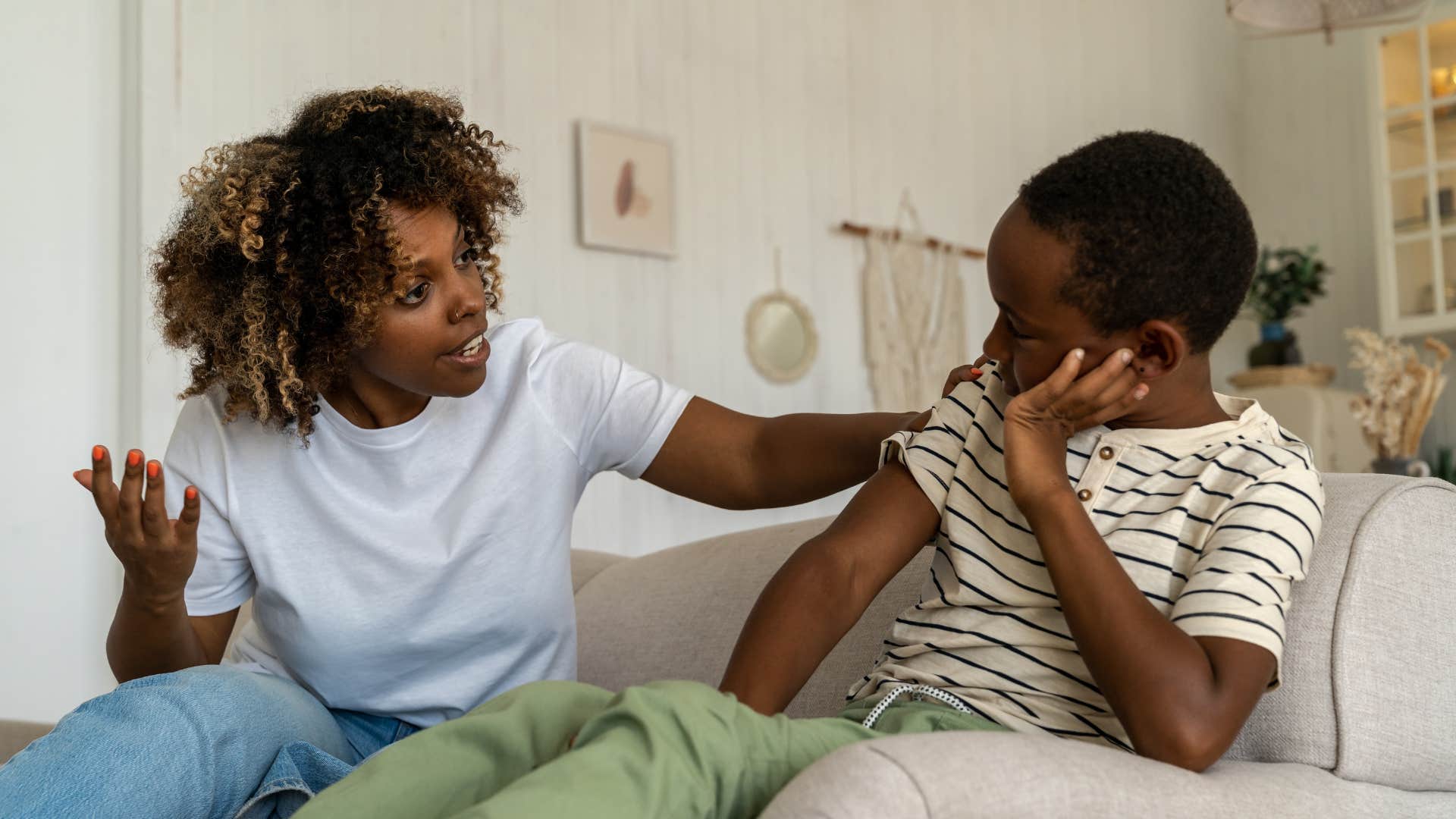 mom having stern talk with son