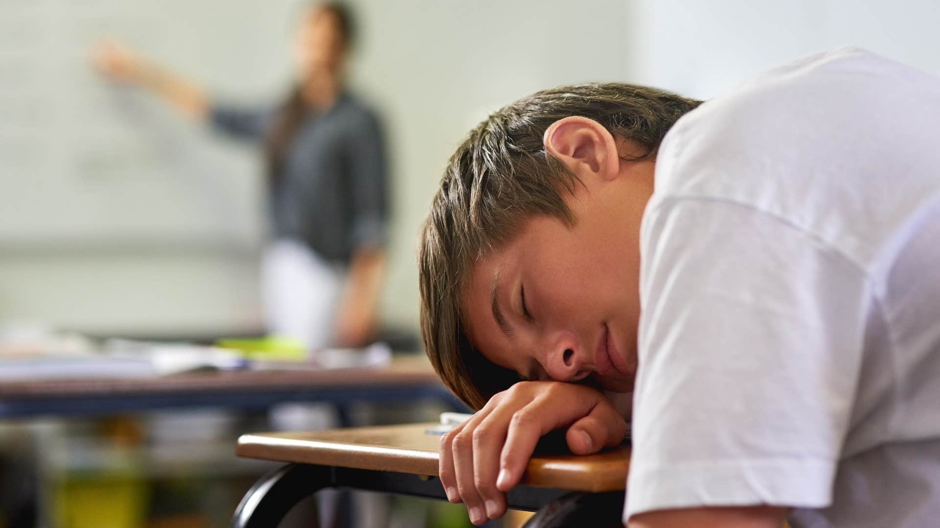 kid sleeping in classroom