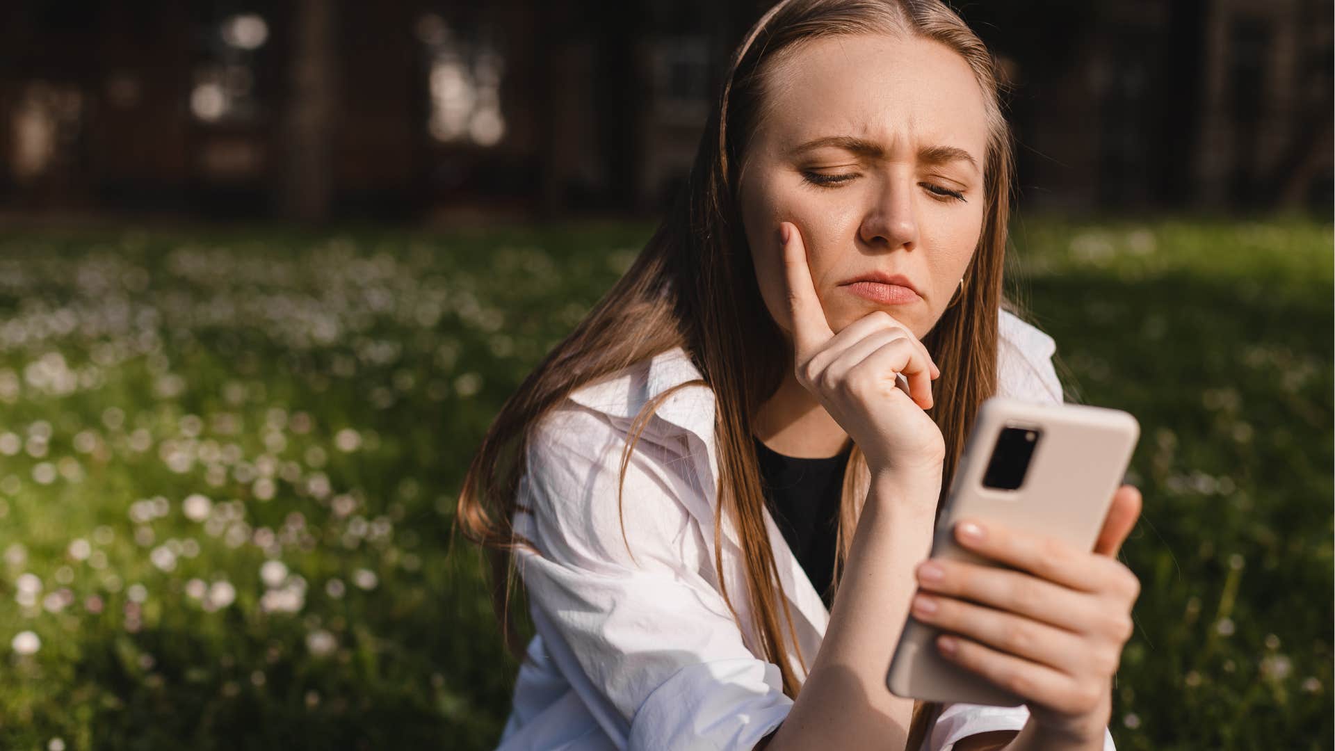annoyed woman texting friends saying no to plans