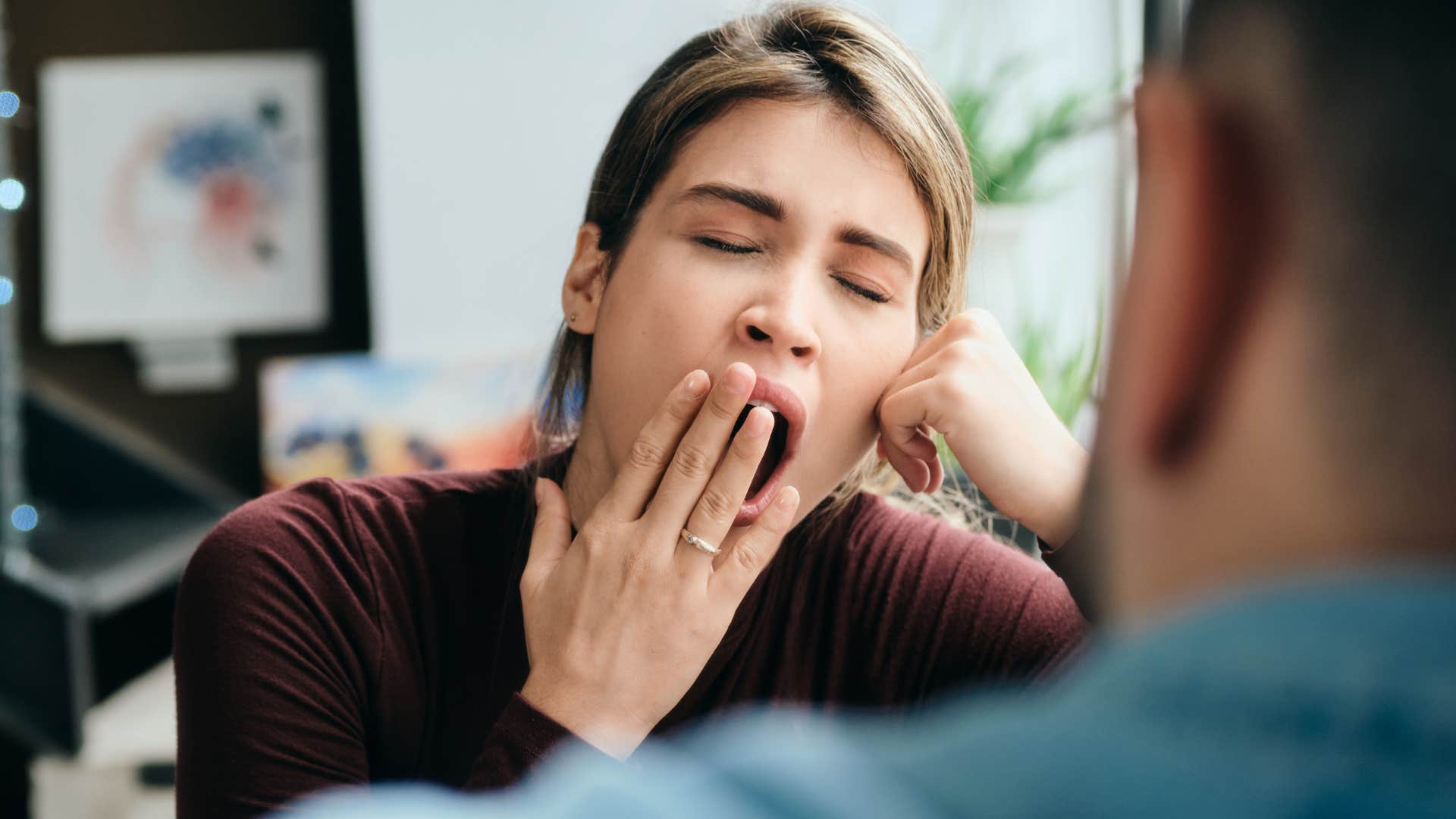 woman yawning and complaining about going to a workout class