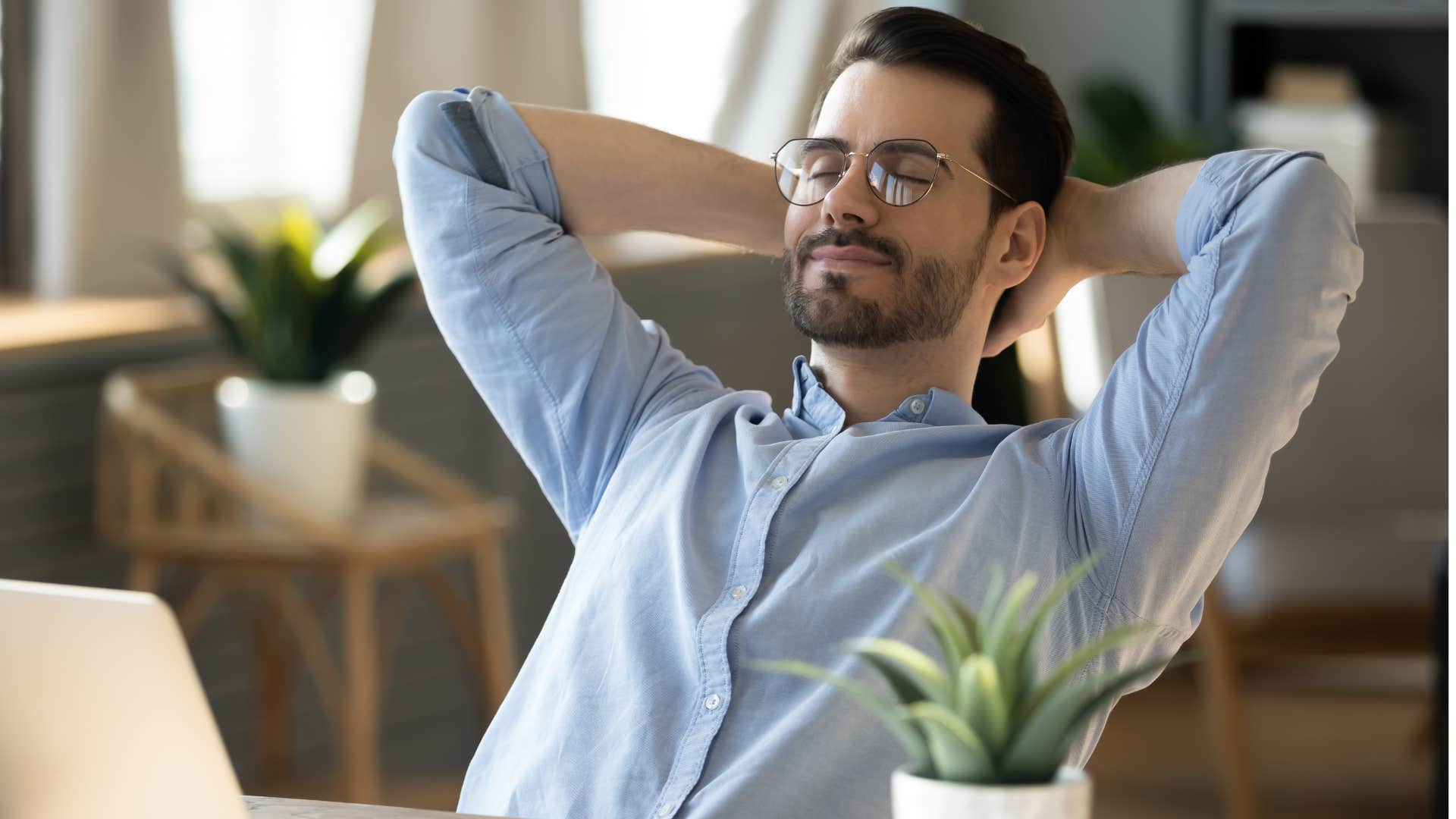 Man taking a break at his work desk.