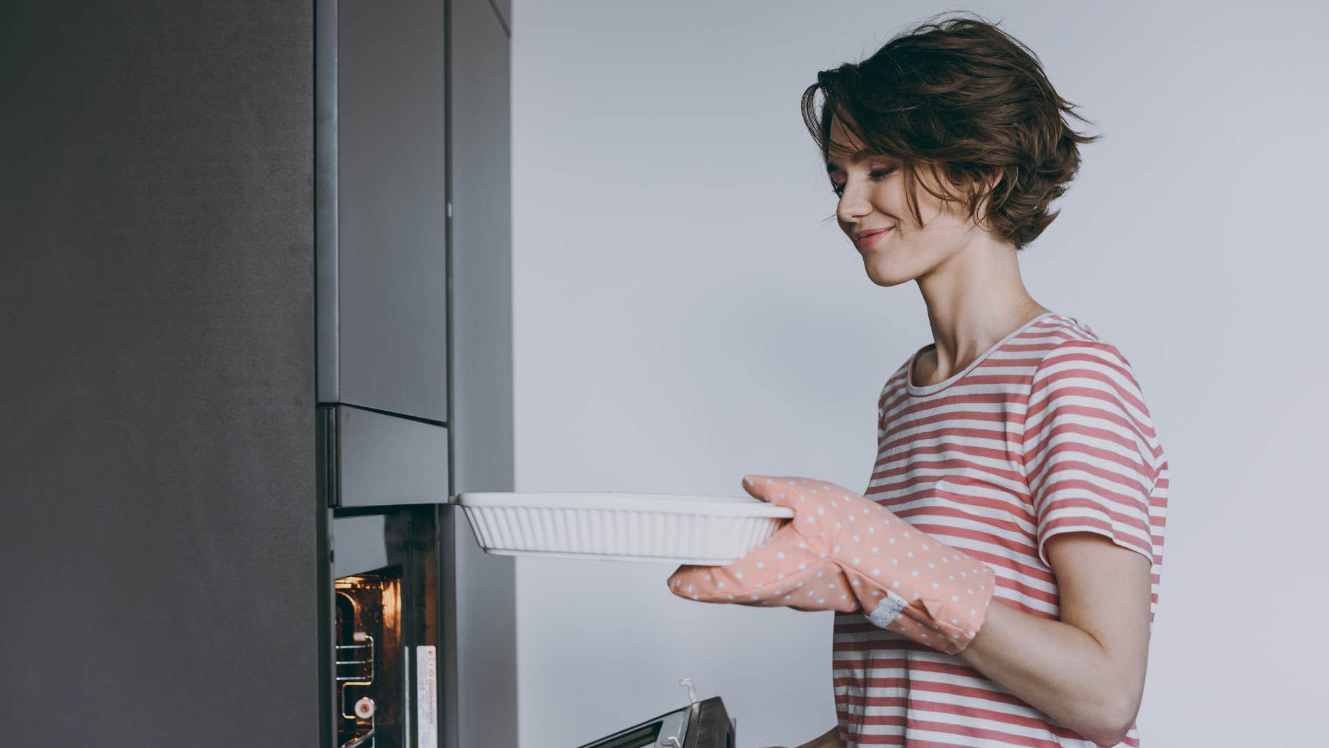frugal woman putting casserole in the freezer