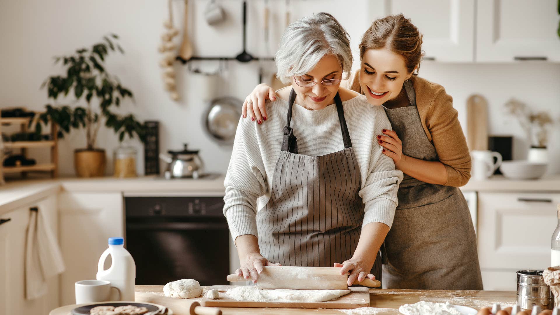 grandmother and granddaughter making homemade dough