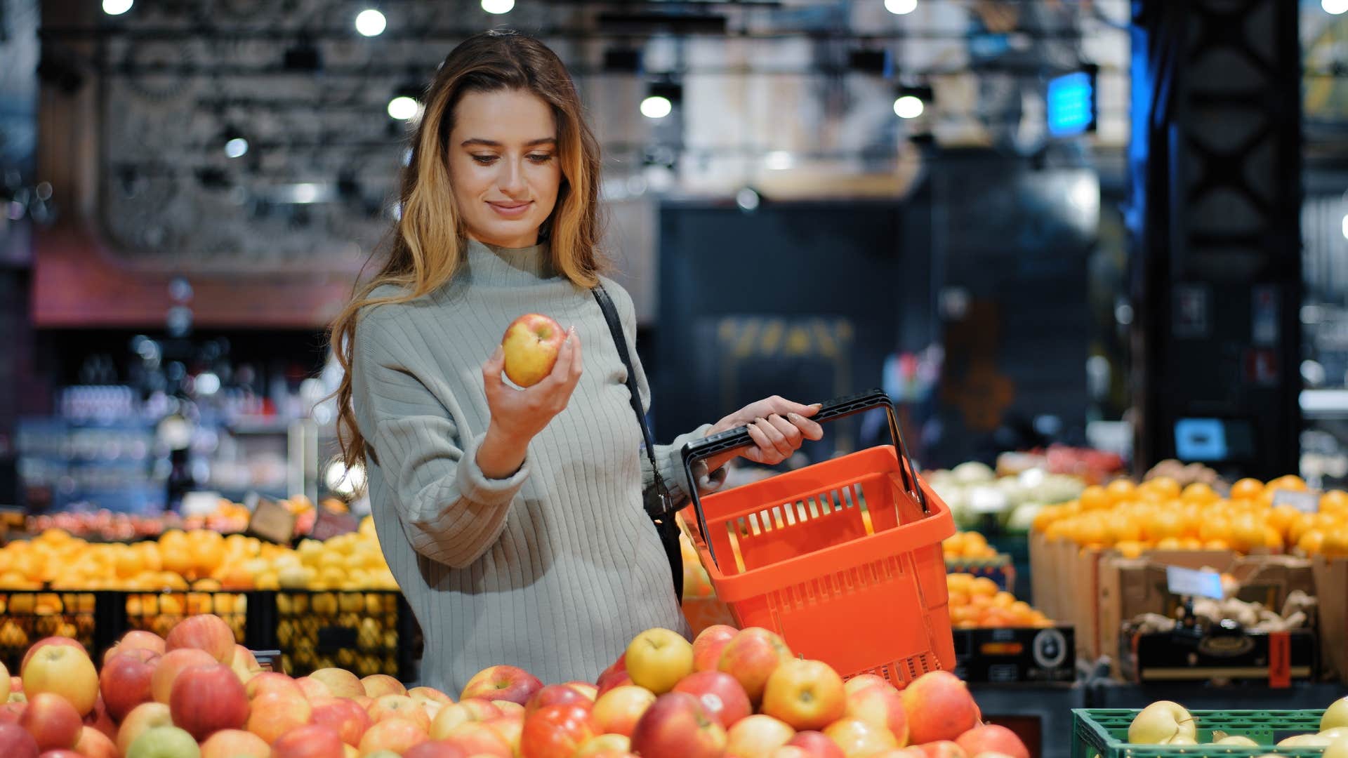 frugal woman shopping for fruit at the grocery store