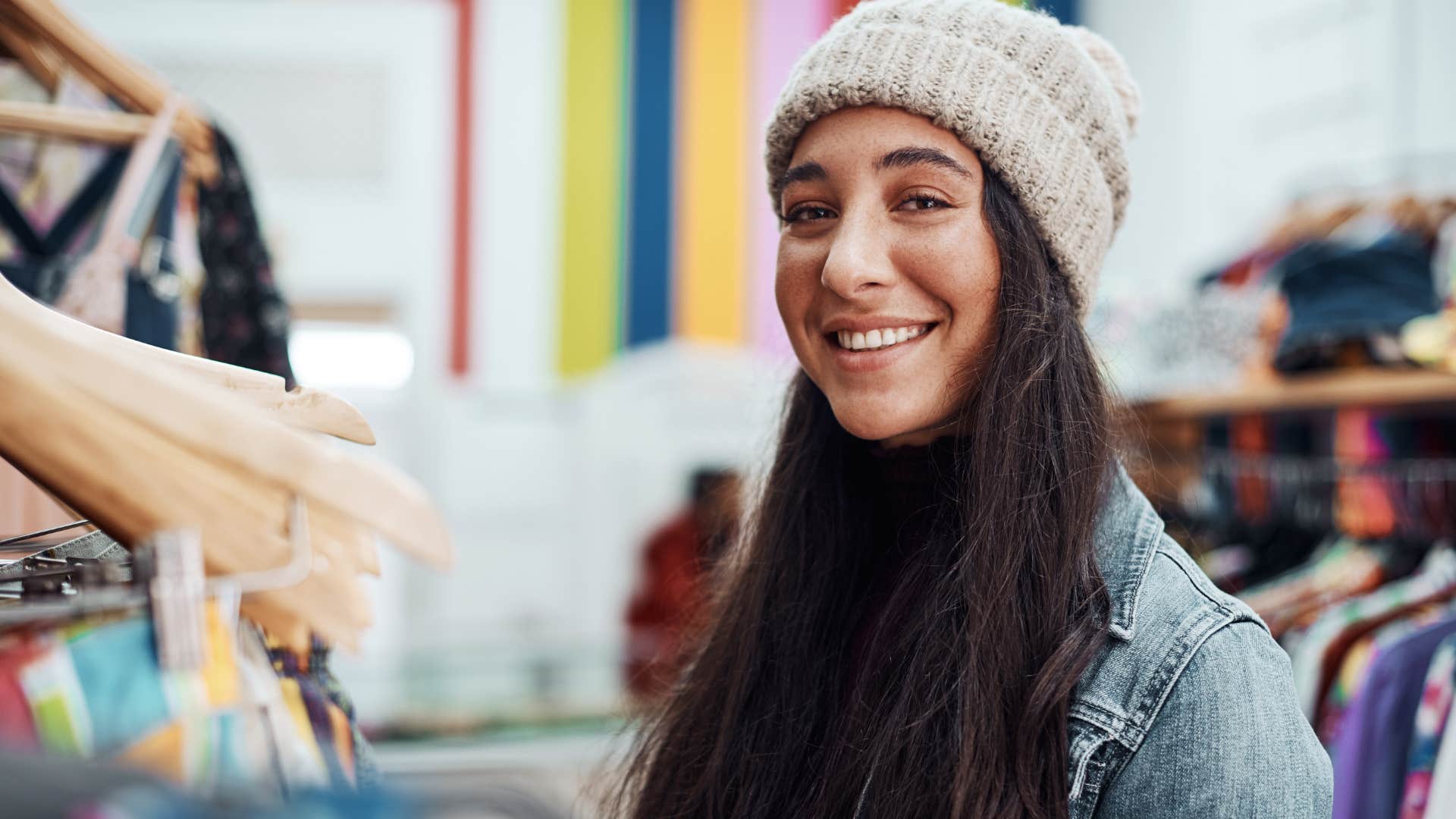 woman living beyond her means saying I'll pay it off later while shopping for clothes