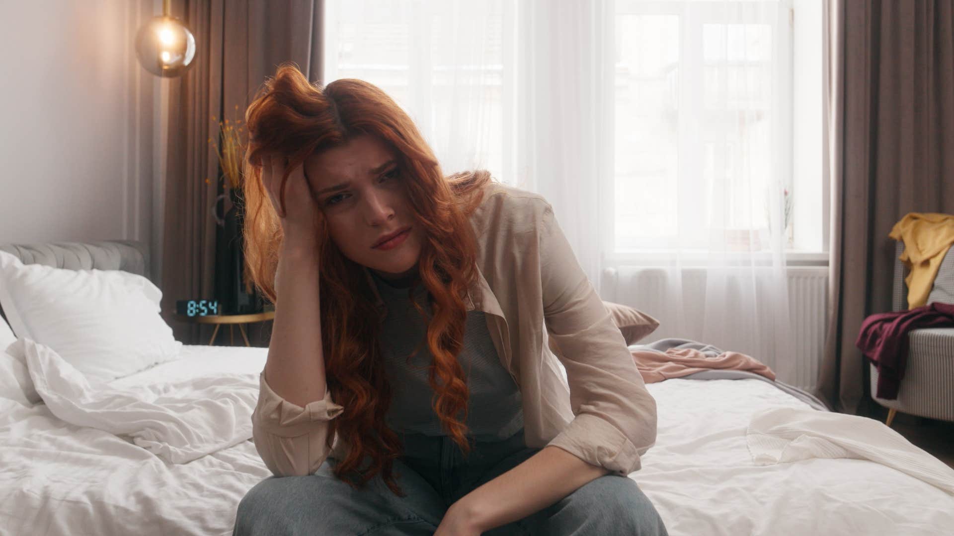 sad woman with messy hair and disheveled appearance