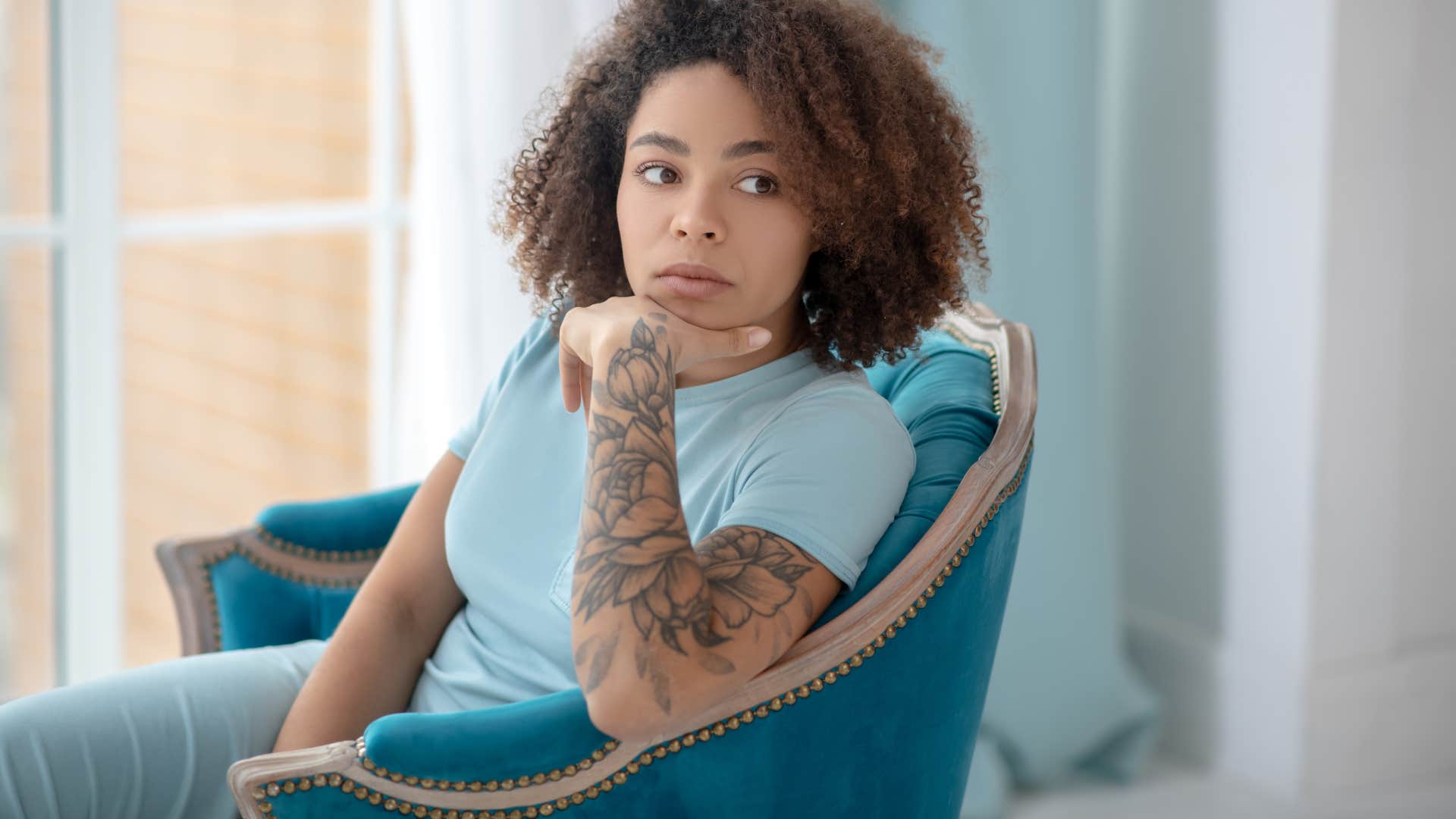 emotionally checked out woman isolating herself at home