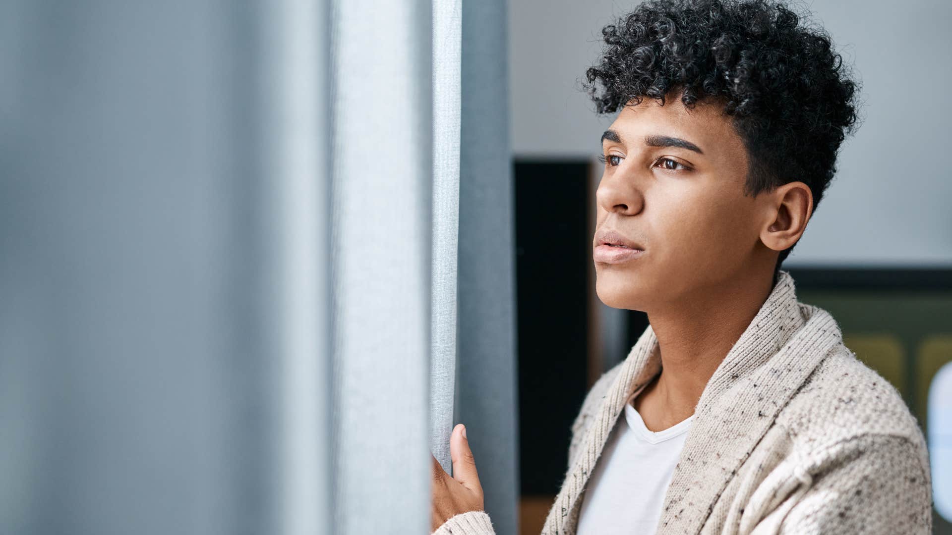man withdrawn from social outings alone at home