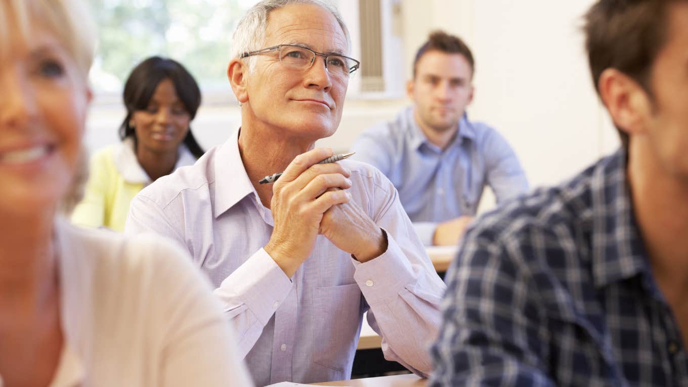 older man sitting in classroom