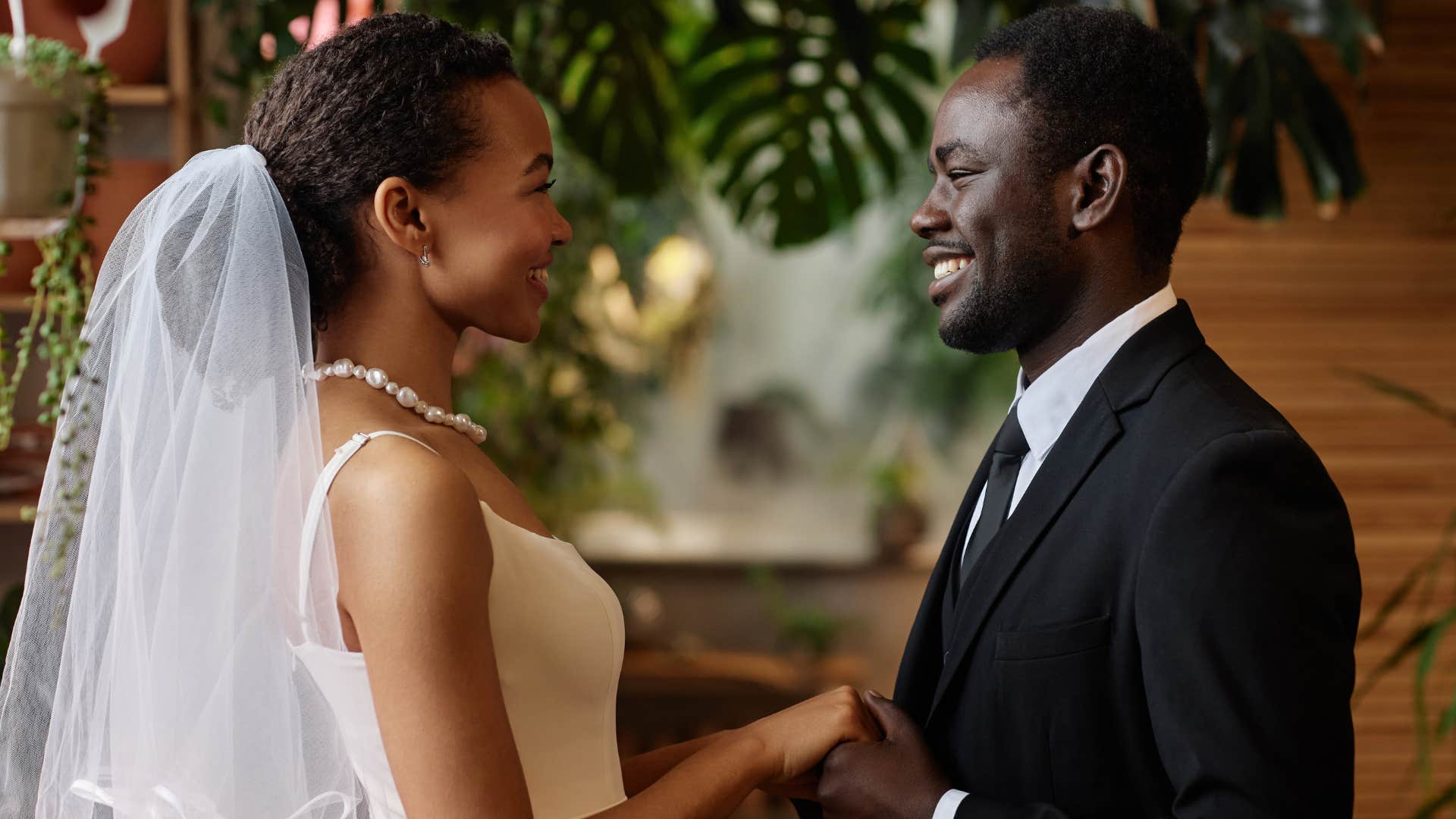 couple standing up at the altar at their wedding